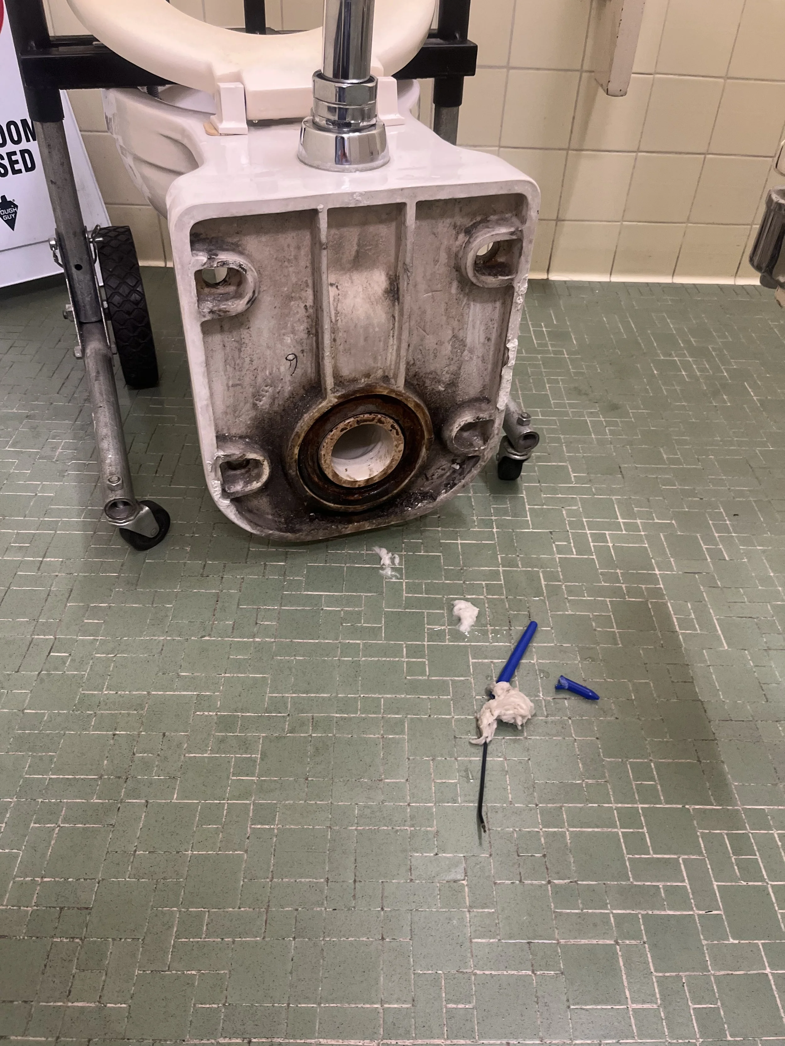 comercial toleit clogged with a ink pen stuck inside and wax ring replacement