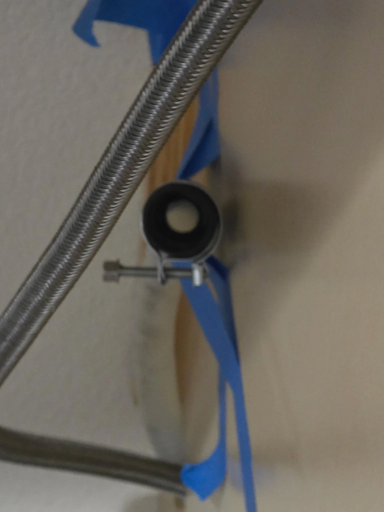 securing a dishwasher water line and drain hose 