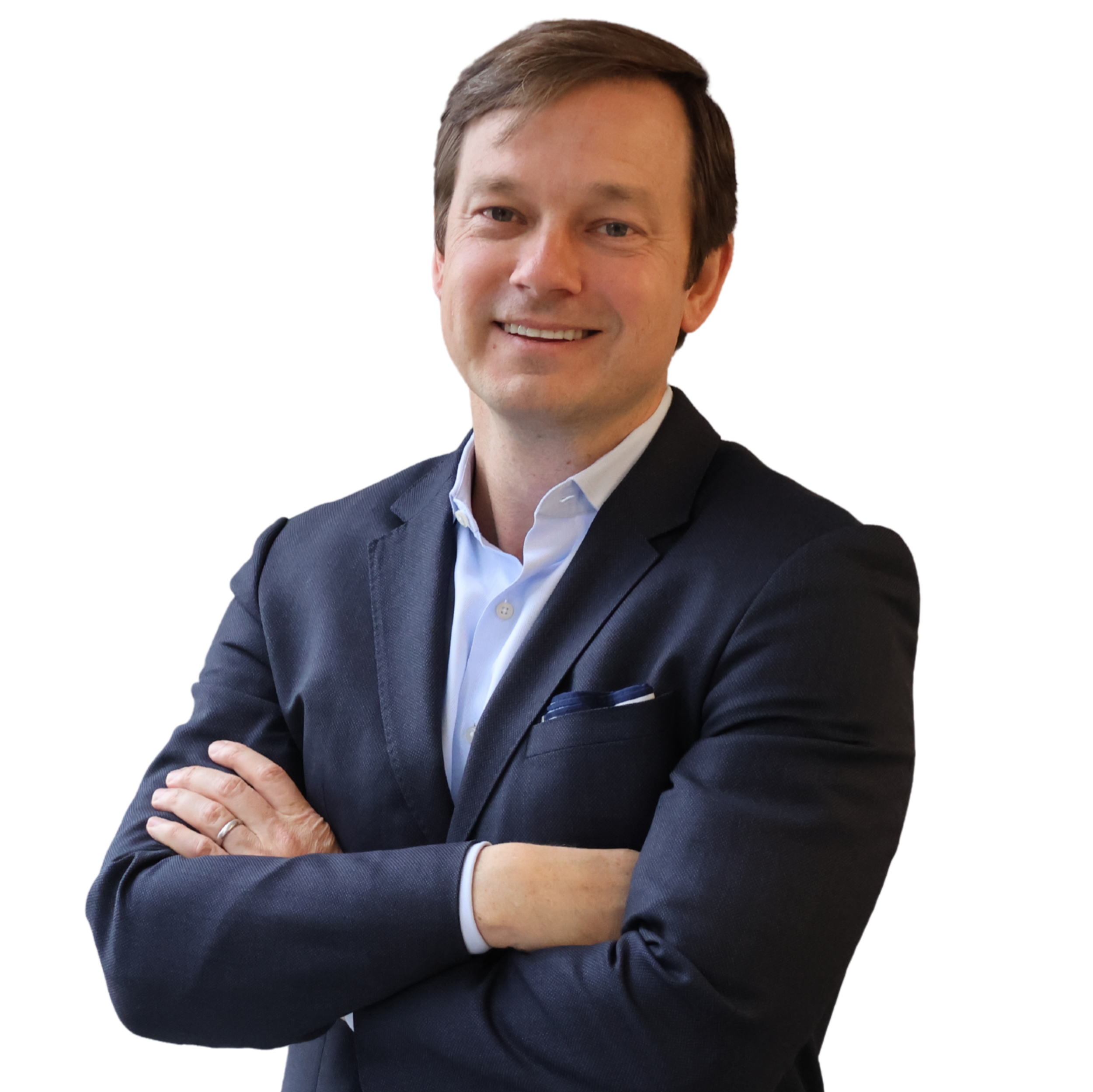 Professional man in a dark suit with crossed arms smiling at the camera.