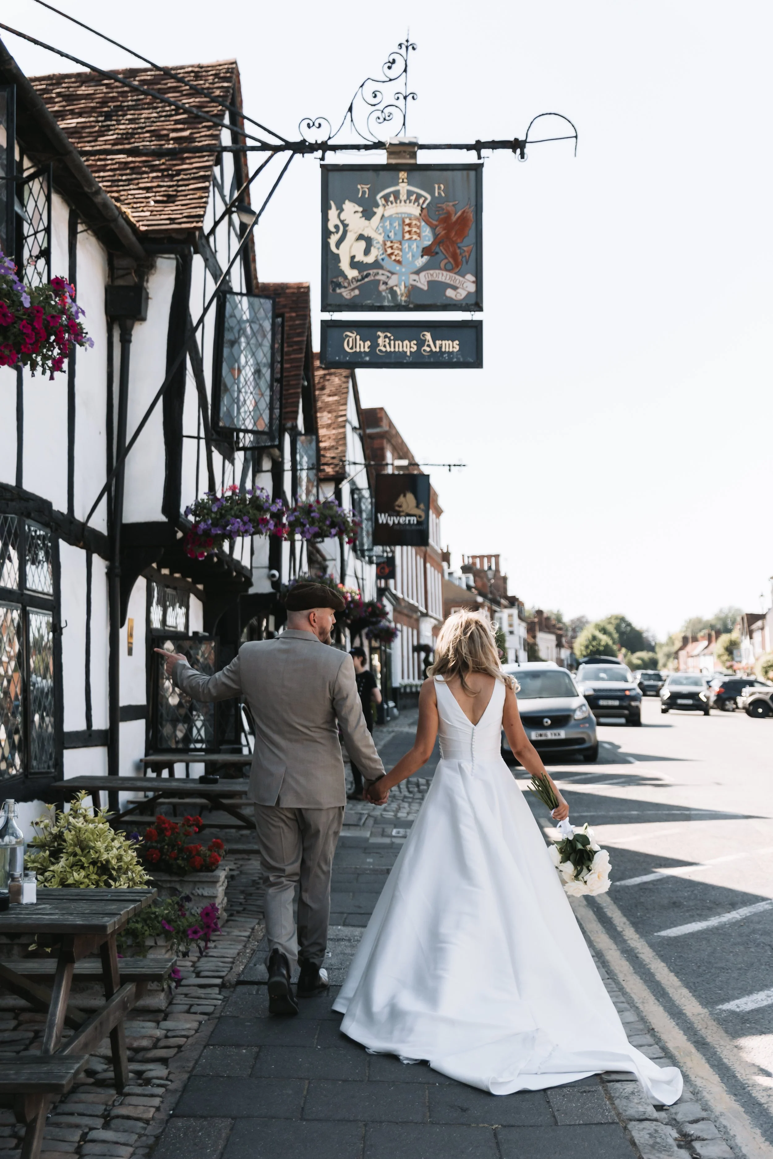 wedding-walk-under-kings-arms-pub-sign-amersham.jpg