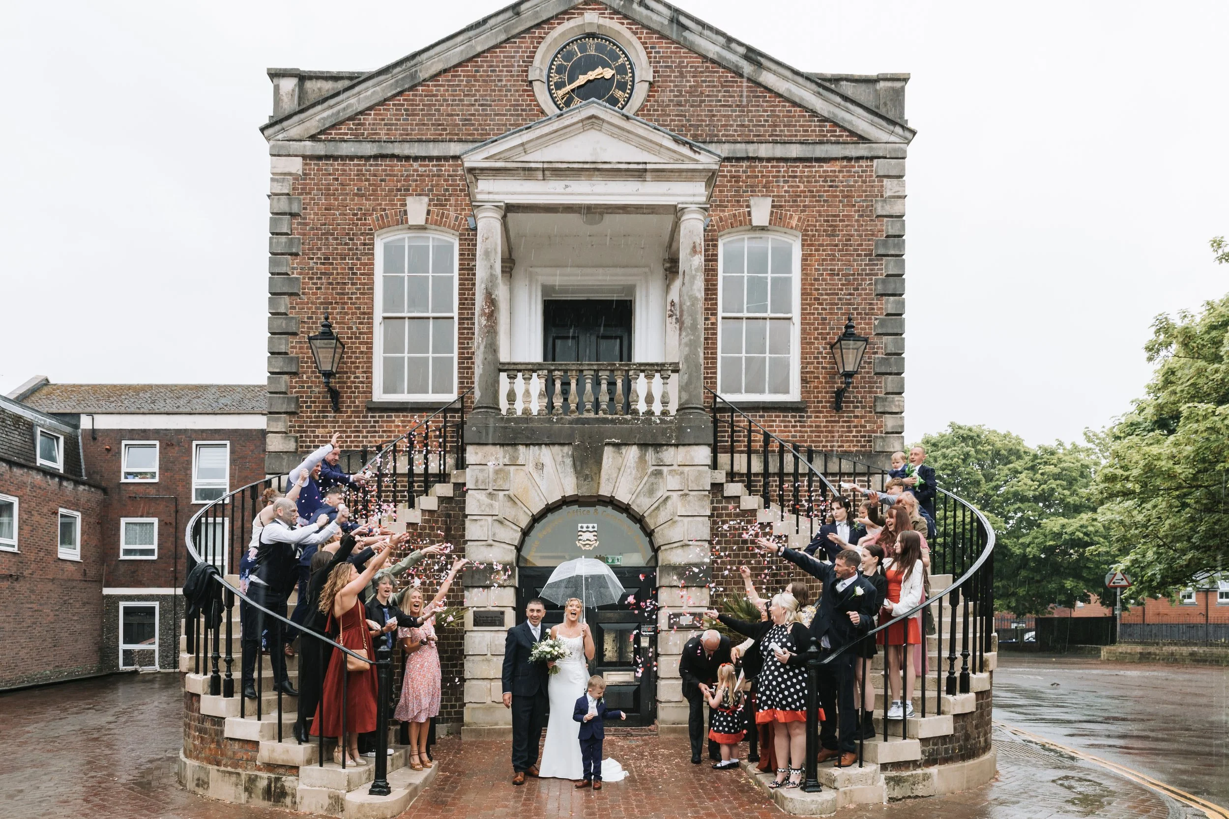 wedding-confetti-group-shot-poole-guildhall-steps.jpg