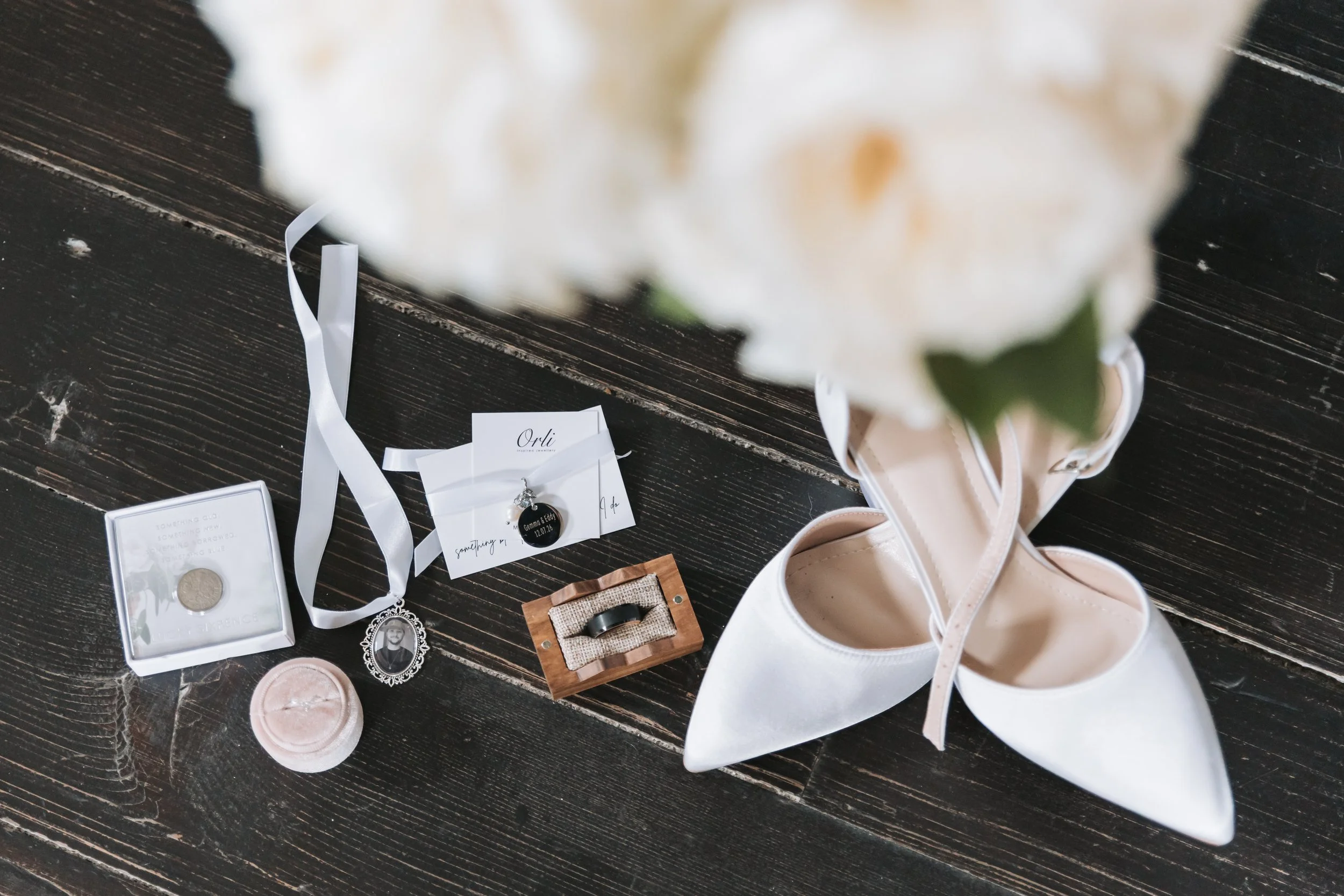 flat-lay-bridal-shoes-rings-jewelry.jpg