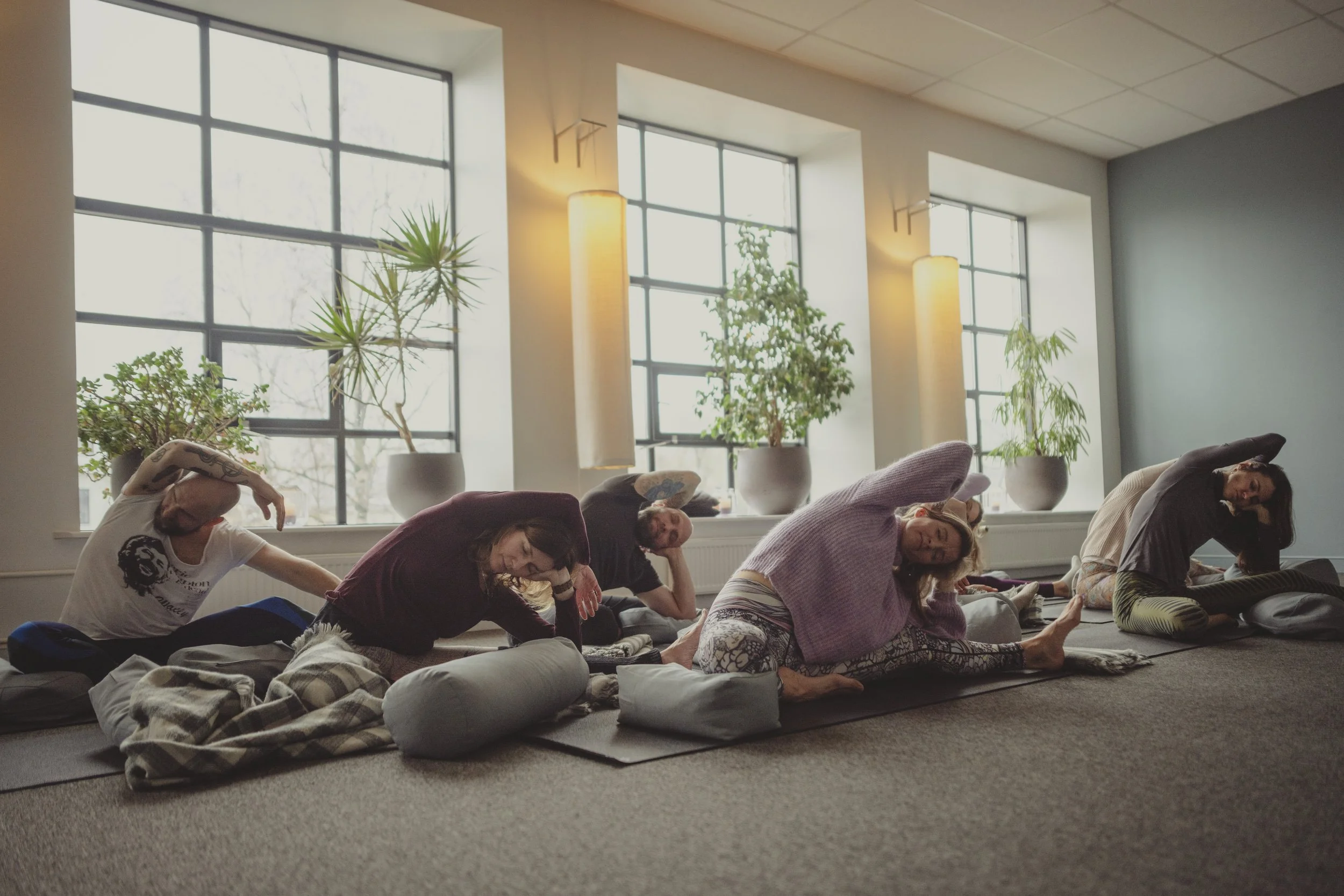Yoga teacher leading group class in Tallinn