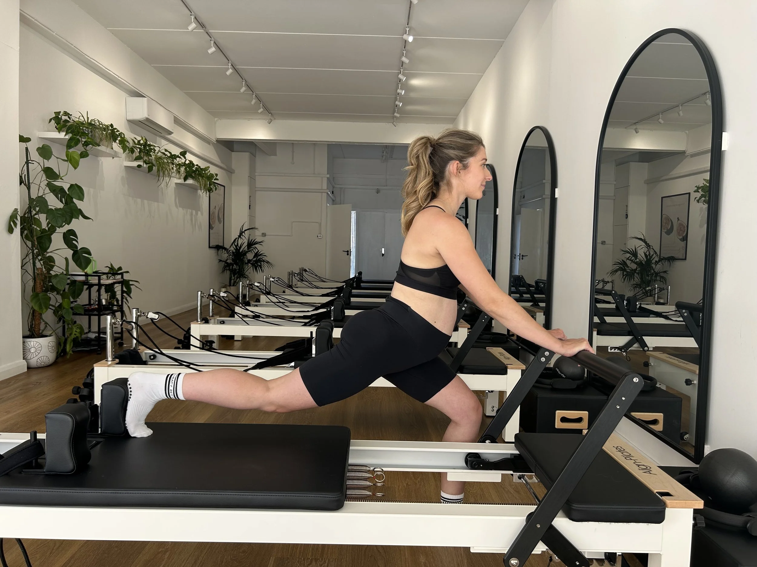 pregnant women doing reformer pilates
