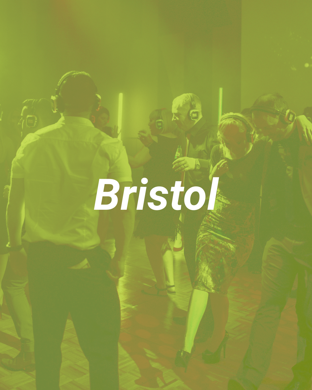 People dancing at a party or nightclub, all wearing virtual reality headsets.