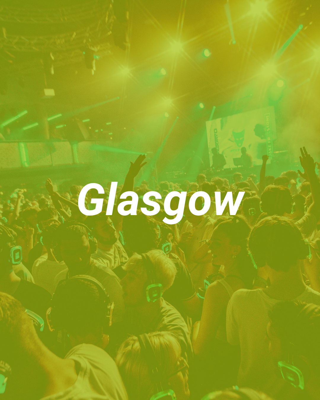 Crowd at a concert or event with stage lighting and people wearing headphones, with the word 'Glasgow' overlaid in the center.