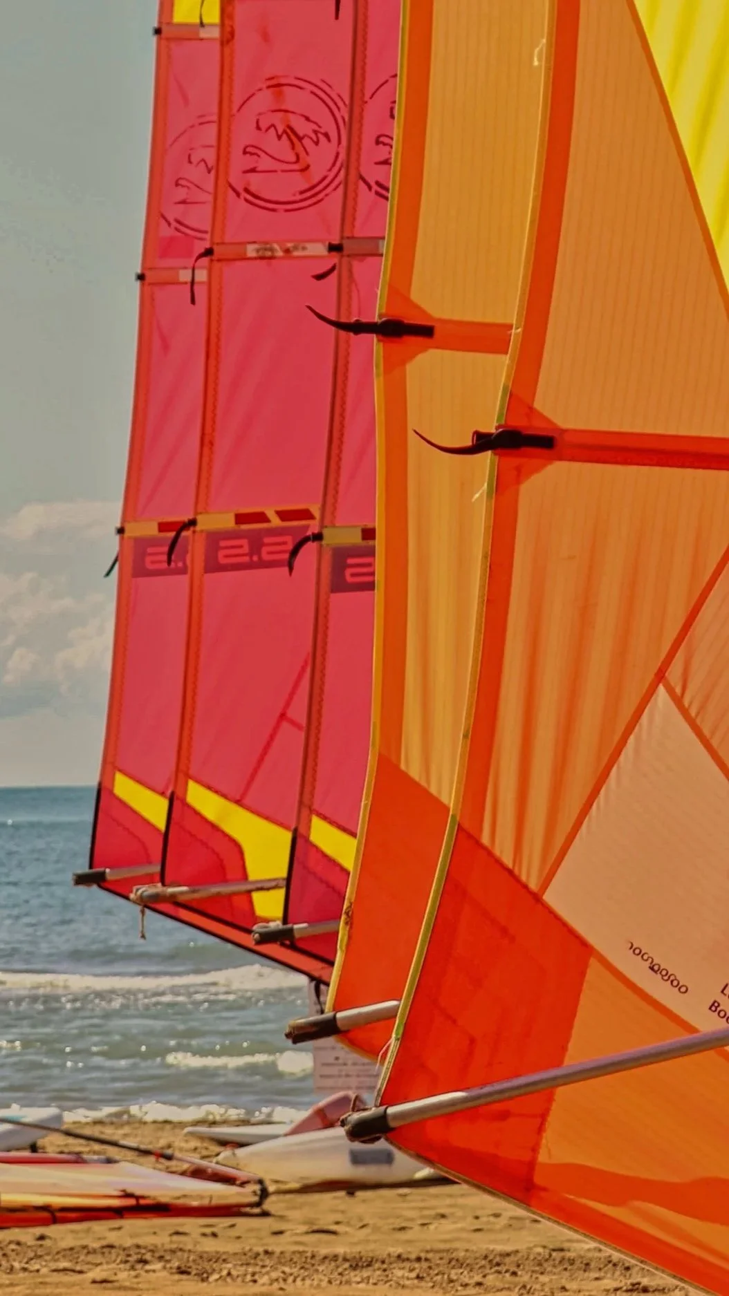 Windsurfing sails against blue sky Aegean Sea