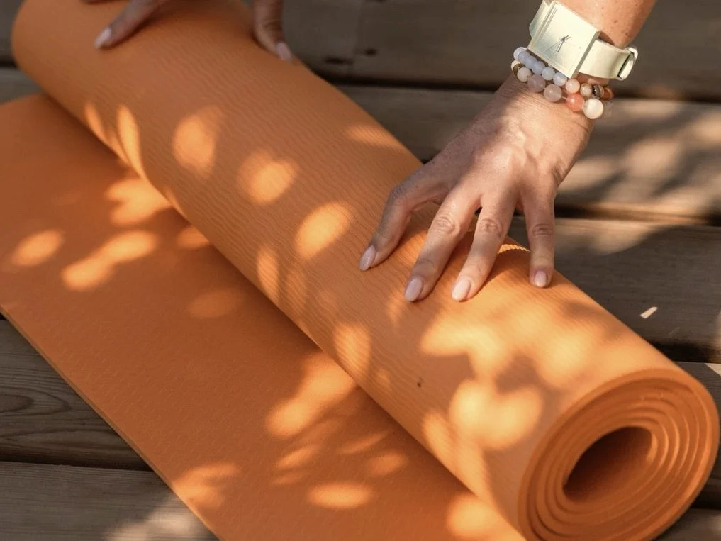 Yoga mat set on a terrace at sunrise