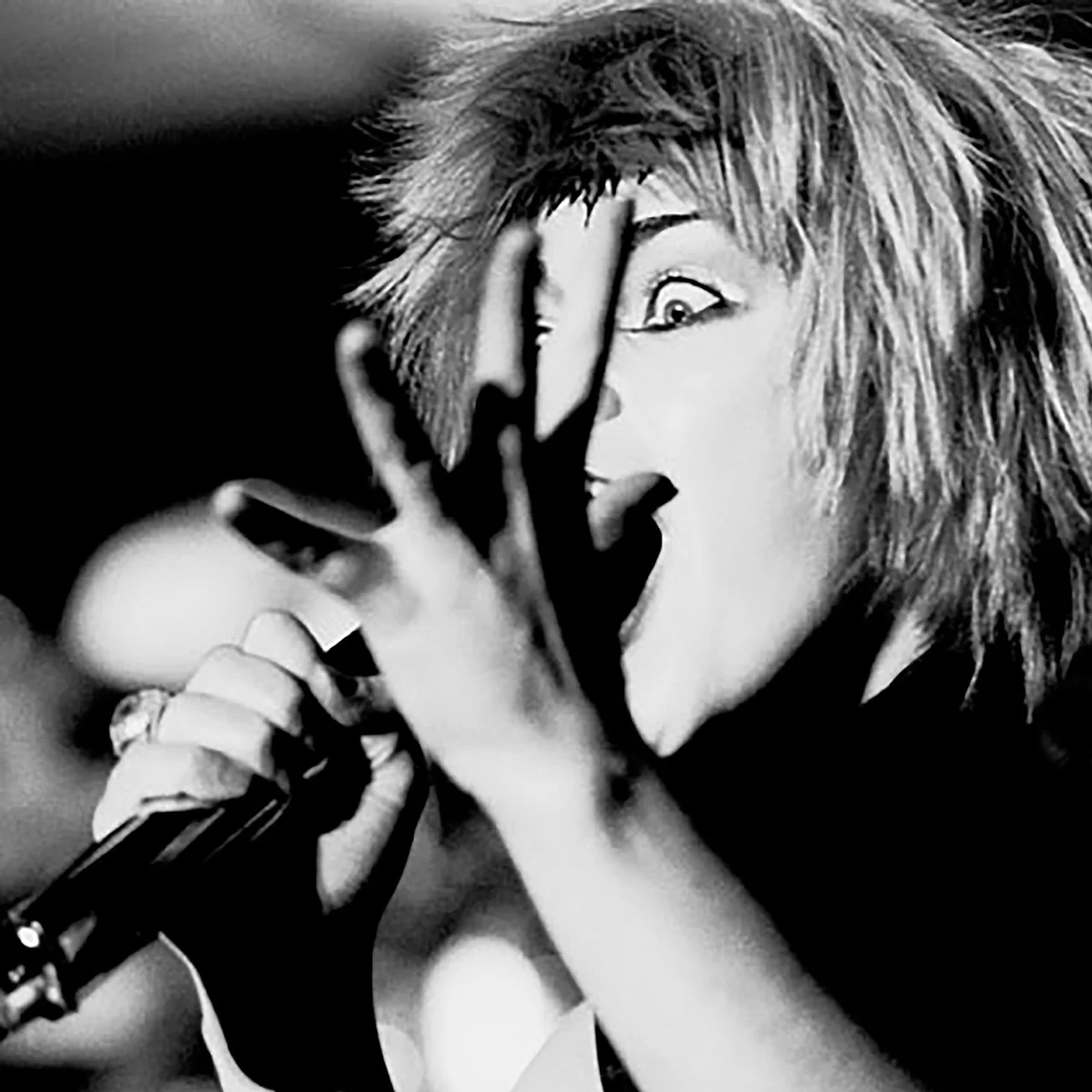 Portrait of Toyah performing on stage.