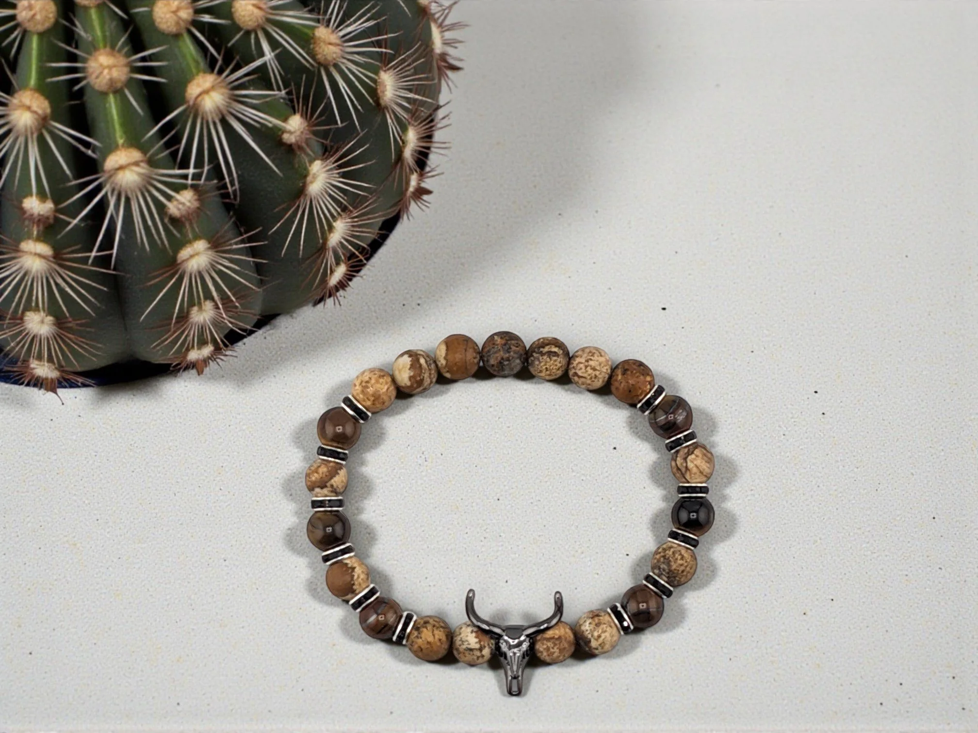Men's bull skull beaded western bracelet with tiger eye and picture jasper separated by black rhinestone spacers