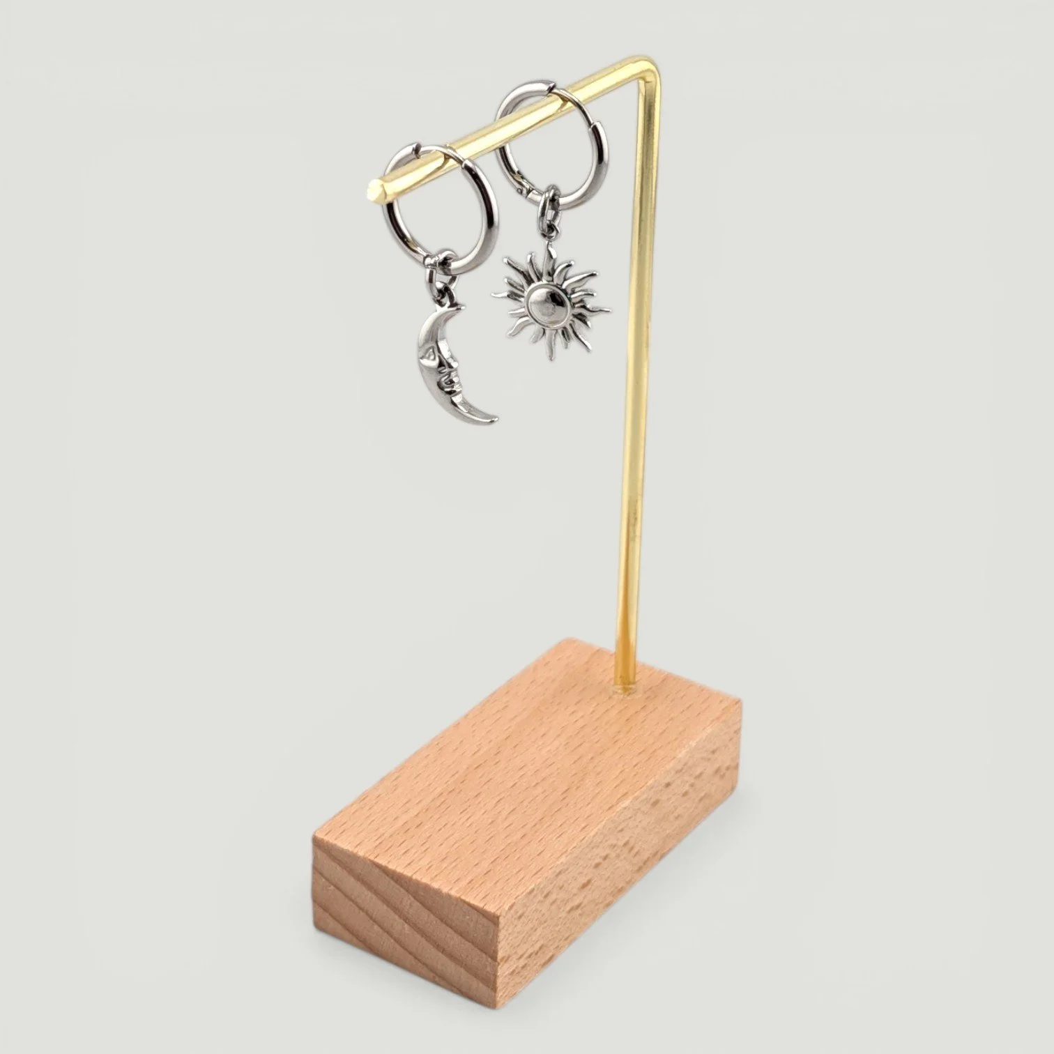Sun & moon stainless steel huggie earrings hanging on display full drop silver