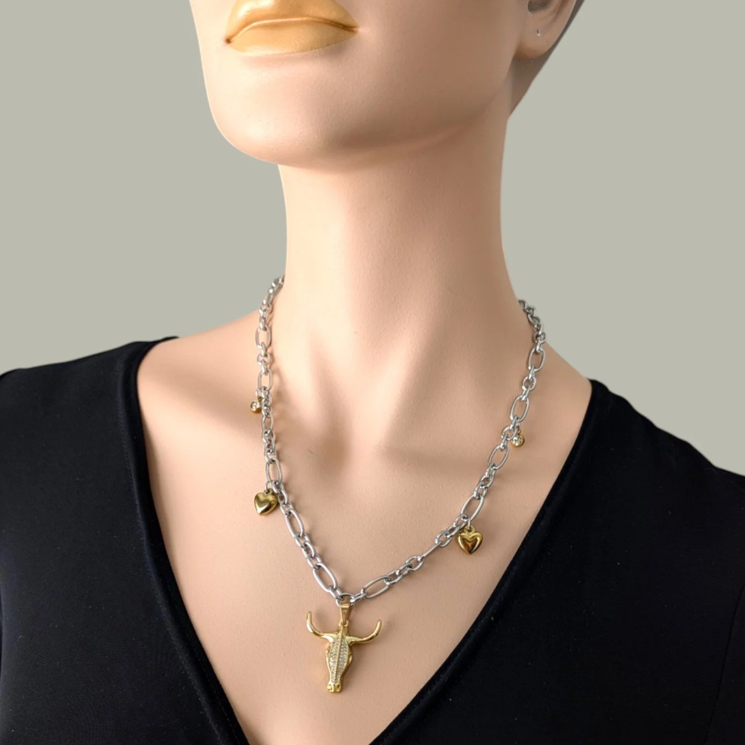 rhinestone bull skull gold stainless steel statement necklace on mannequin bust close up view