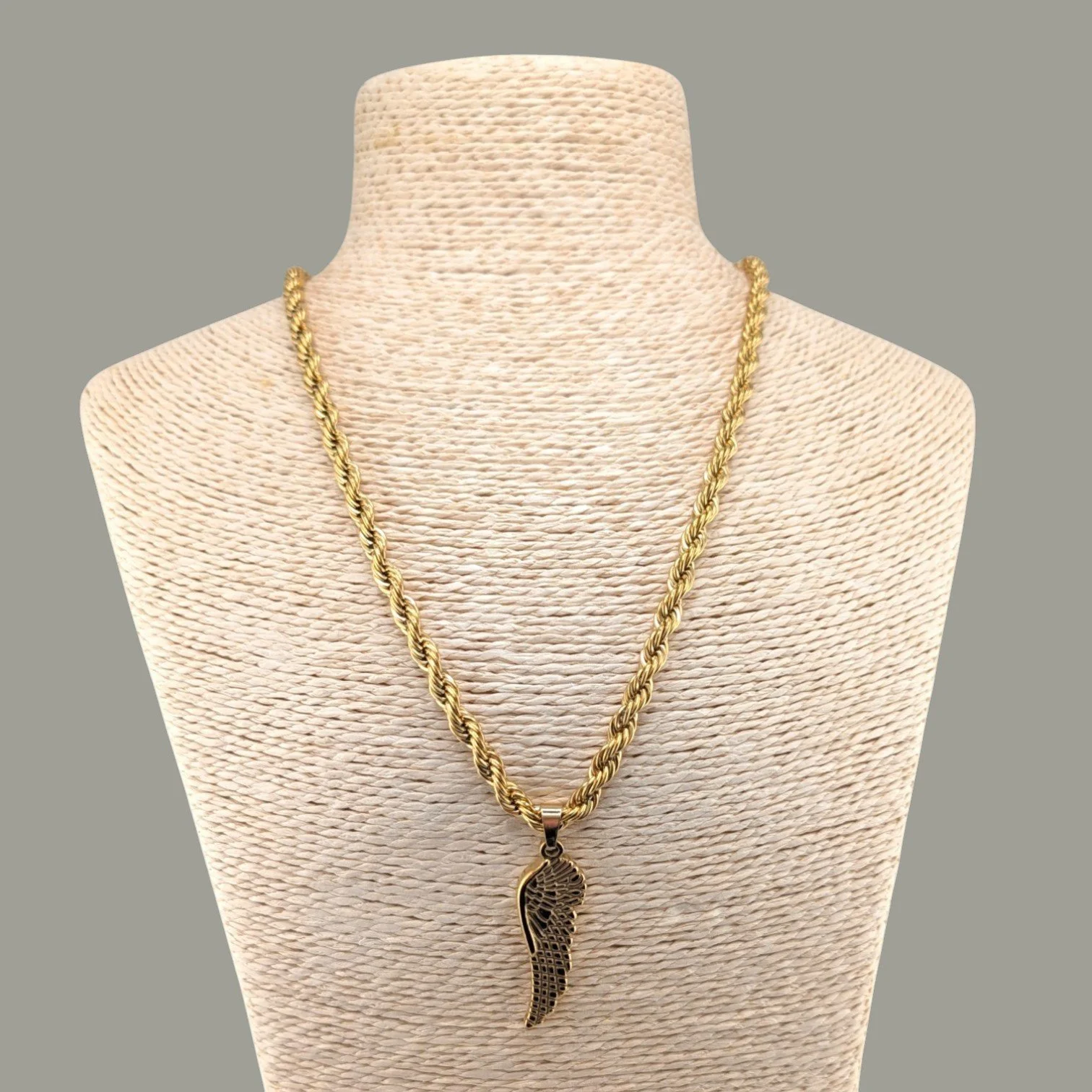 chunky wing gold stainless steel statement necklace on bust close up