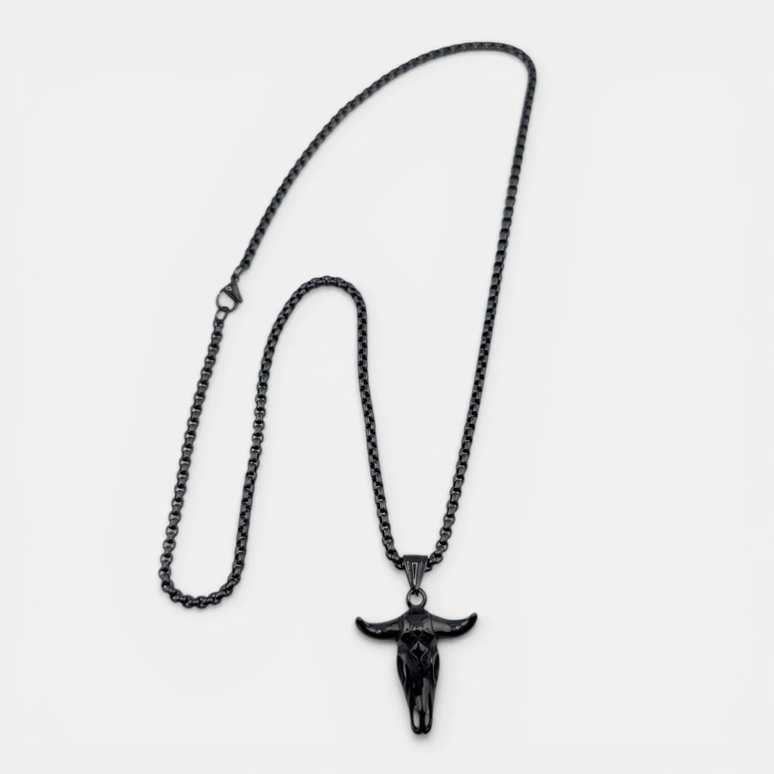 men's bull skull black stainless steel necklace full flat lay showing 3mm box chain and pendant