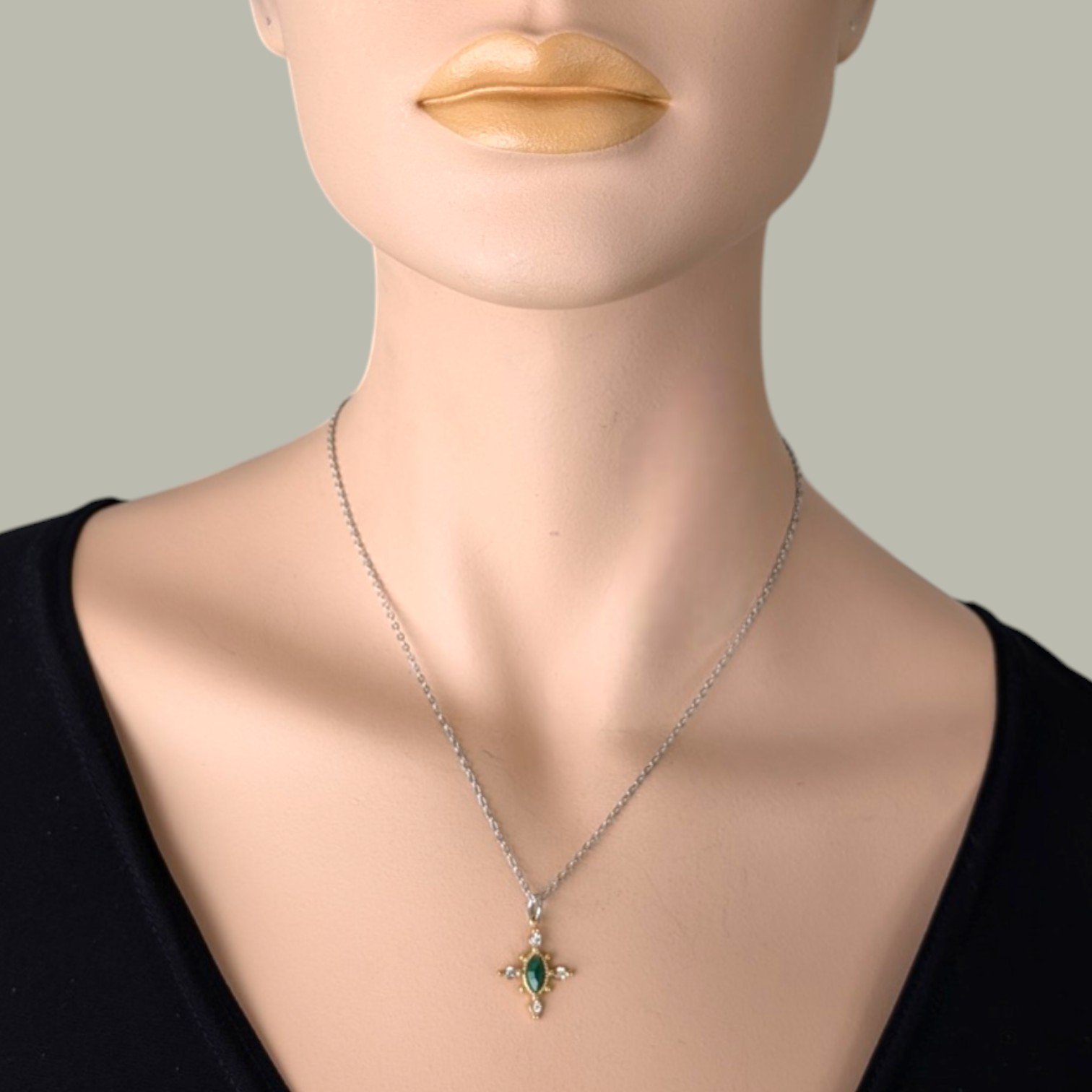 Horse eye African jade necklace on a silver stainless steel chain worn on  mannequin, close up bust view