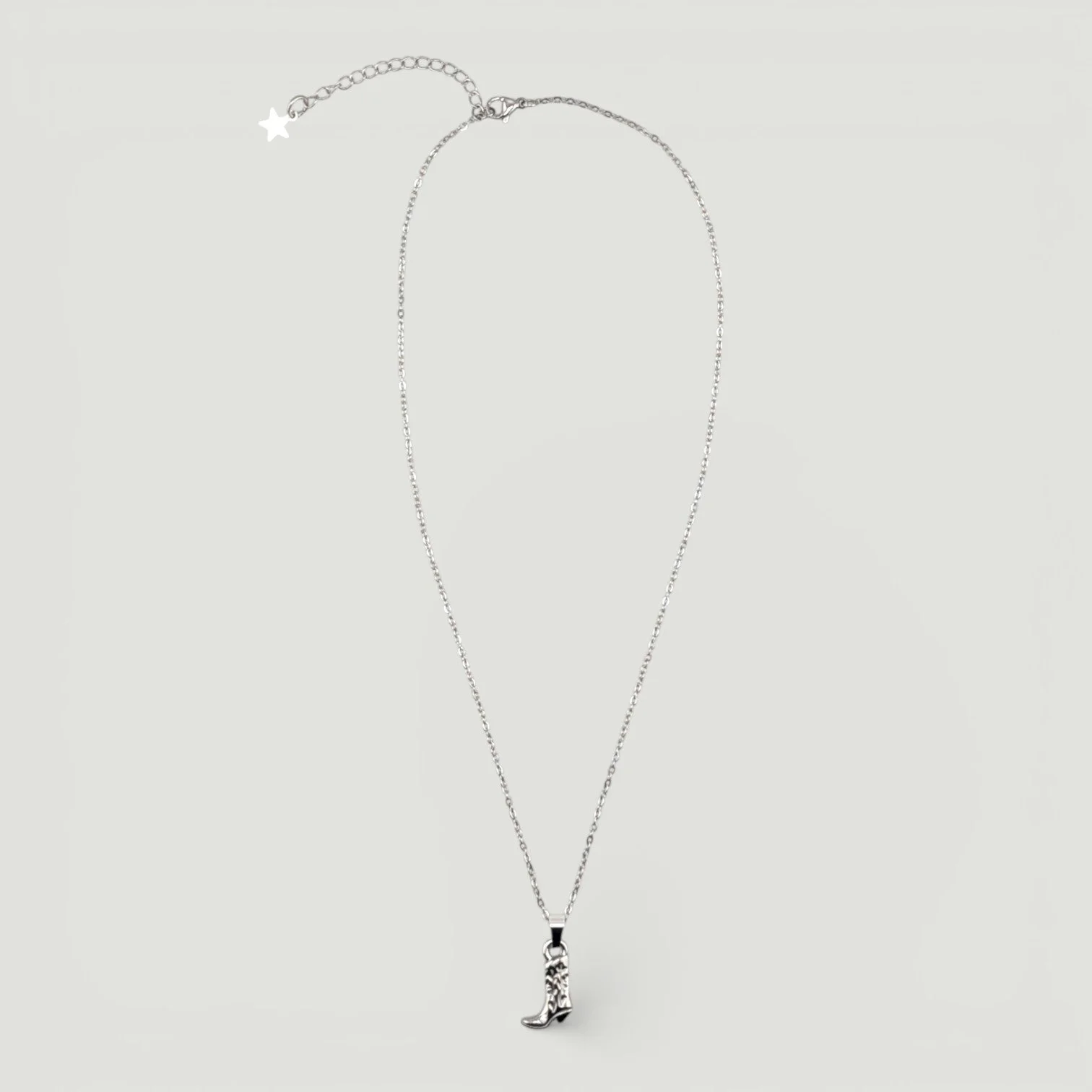 silver stainless steel cowboy boot necklace full chain flat lay