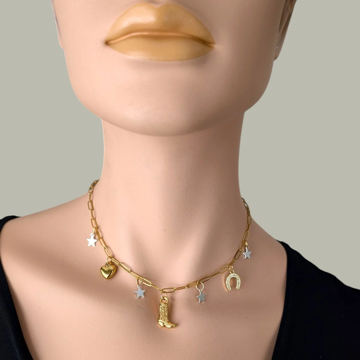 gold cowboy boot stainless steel charm necklace on mannequin bust close up view