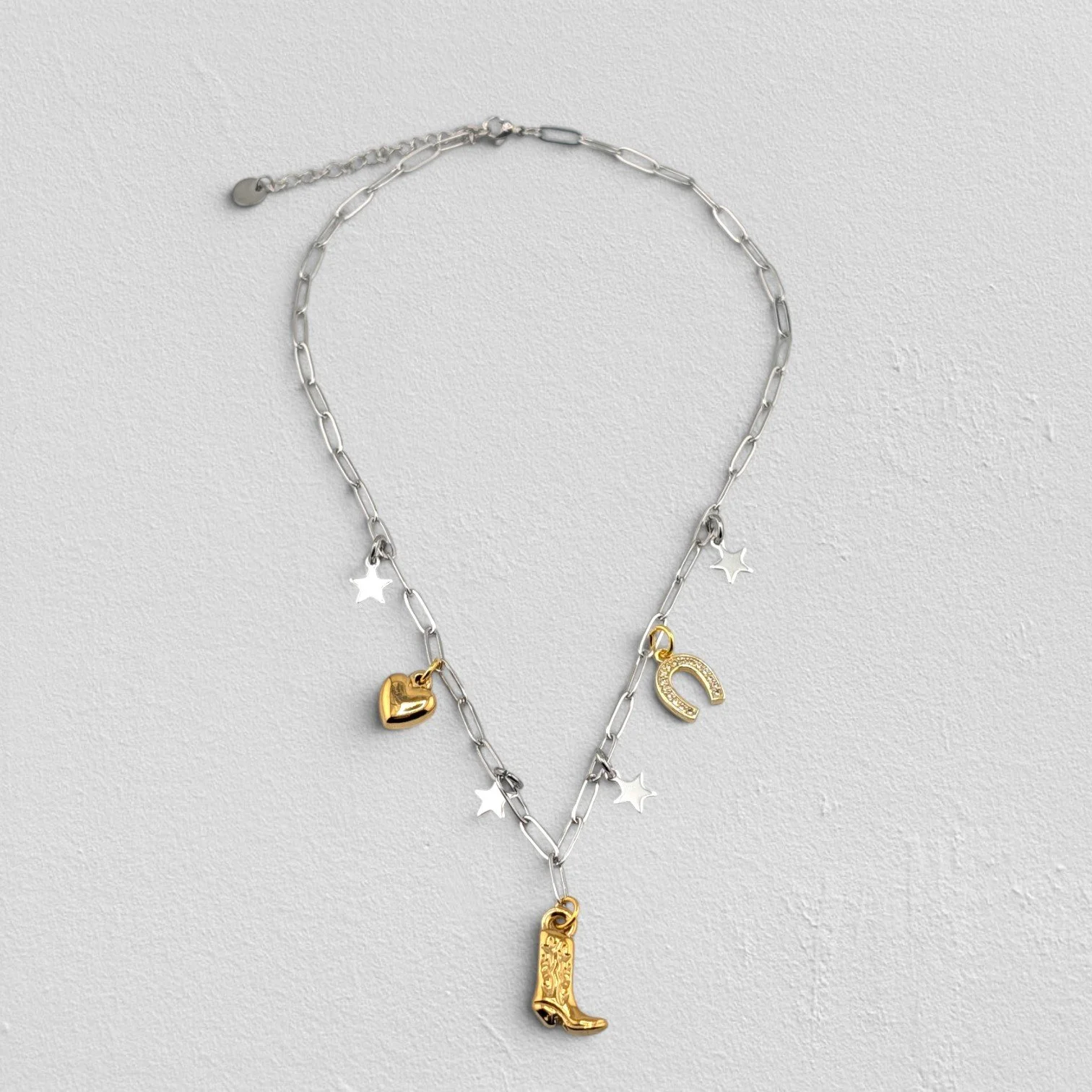 silver cowboy boot stainless steel charm necklace full view flat lay