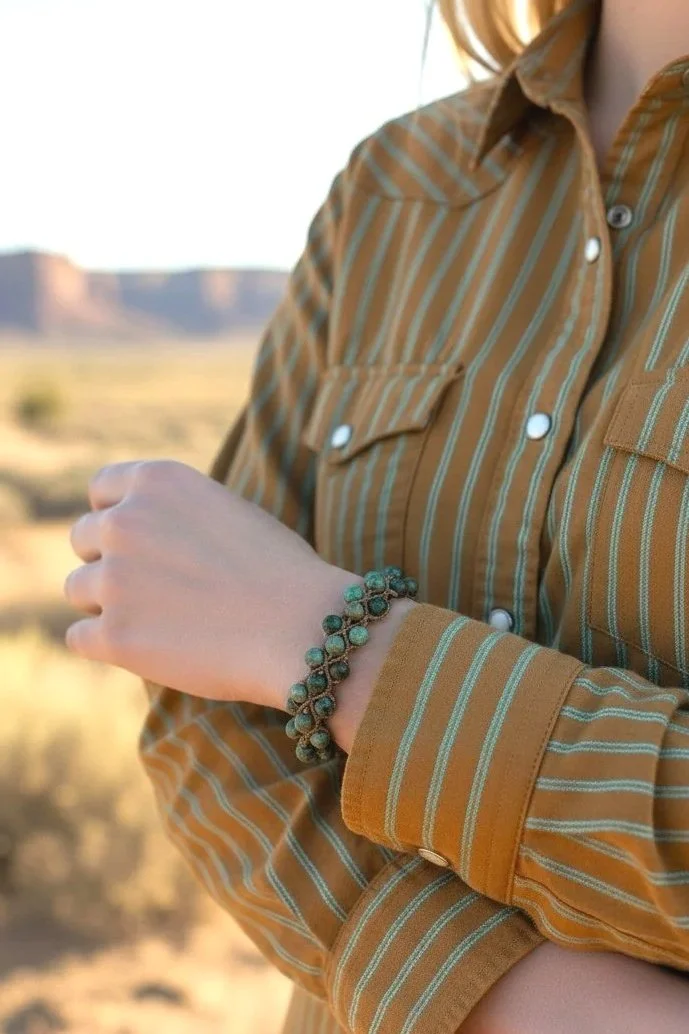 cowgirl showing her african turquoise western macramé bracelet