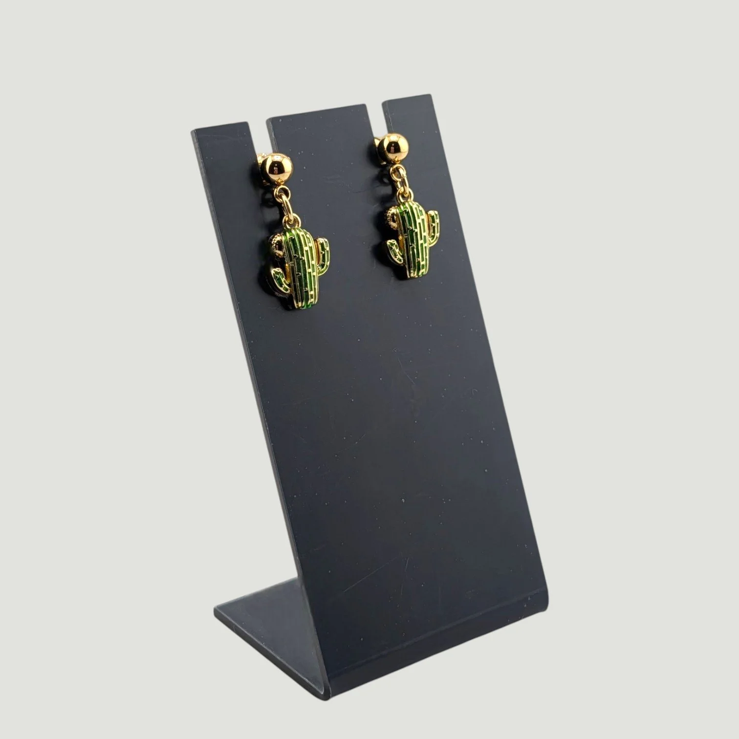 cactus enamel stud drop earrings, green, on earring stand, drop view