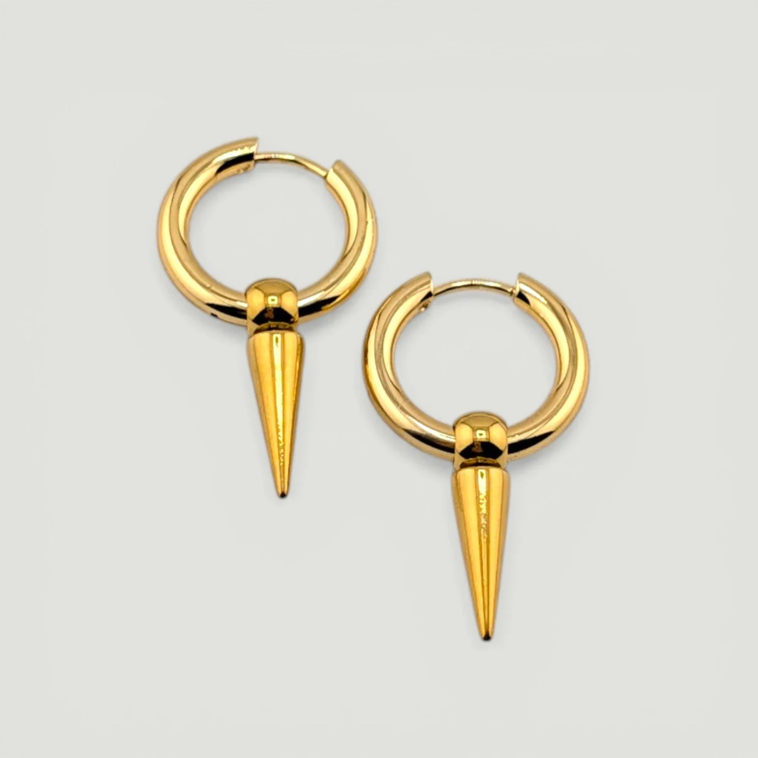 gold stainless steel huggie hoop earrings, flat lay