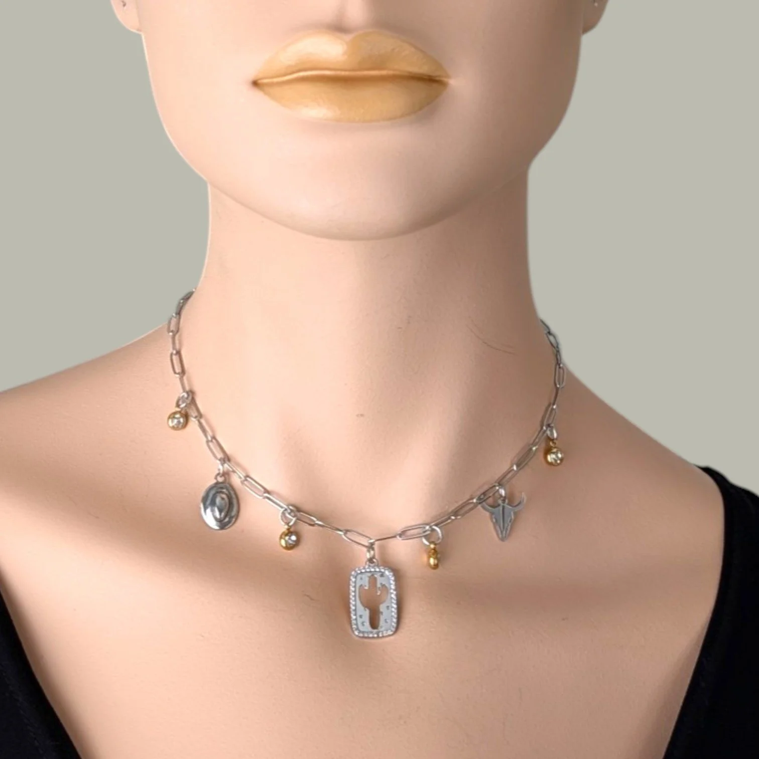 cactus and bull skull silver paperclip charm necklace on mannequin bust close up