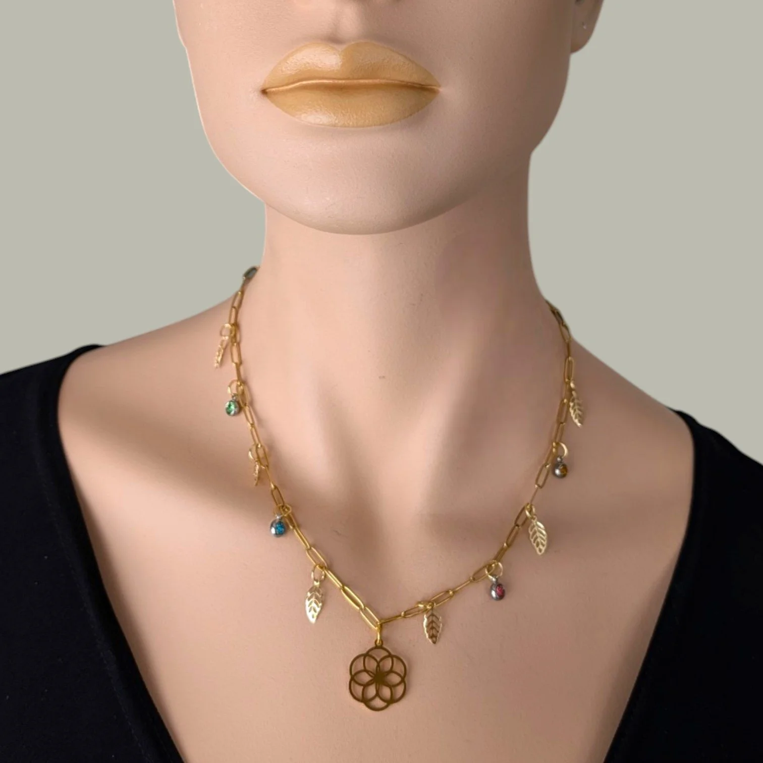 seed of life gold stainless steel paperclip charm necklace on mannequin bust close up