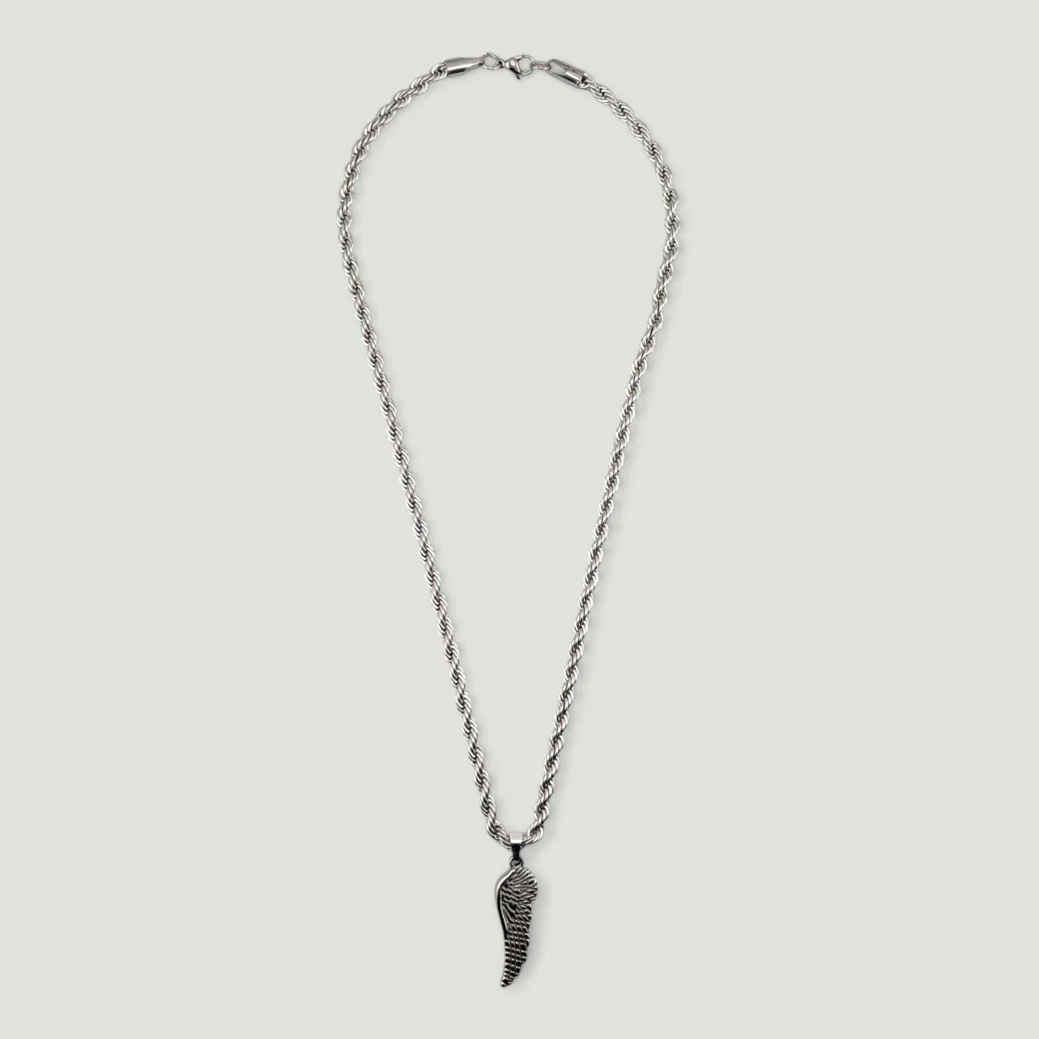 men's wing stainless steel necklace full view flat lay showing rope chain and pendant