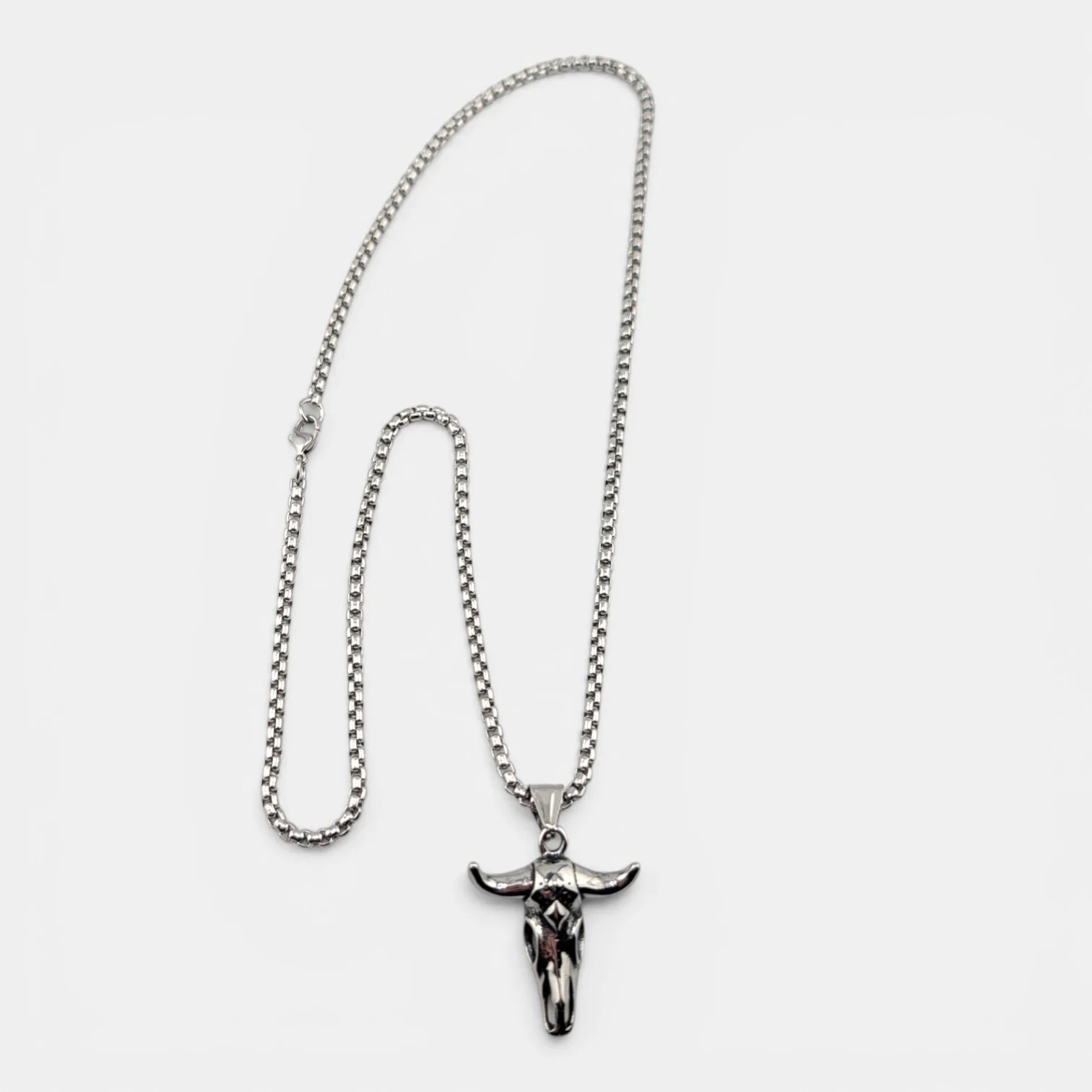 men's bull skull silver stainless steel necklace full view flat lay showing 3mm box chain and pendant