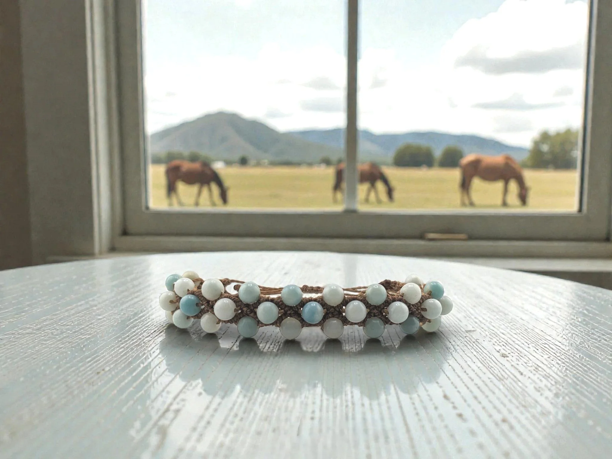 woven amazonite macramé bracelet on a table