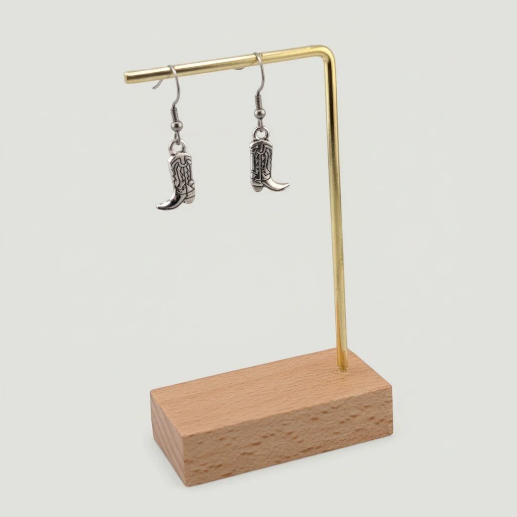 Cowboy boot drop earrings on display stand showing full drop length, silver tone Western earrings
