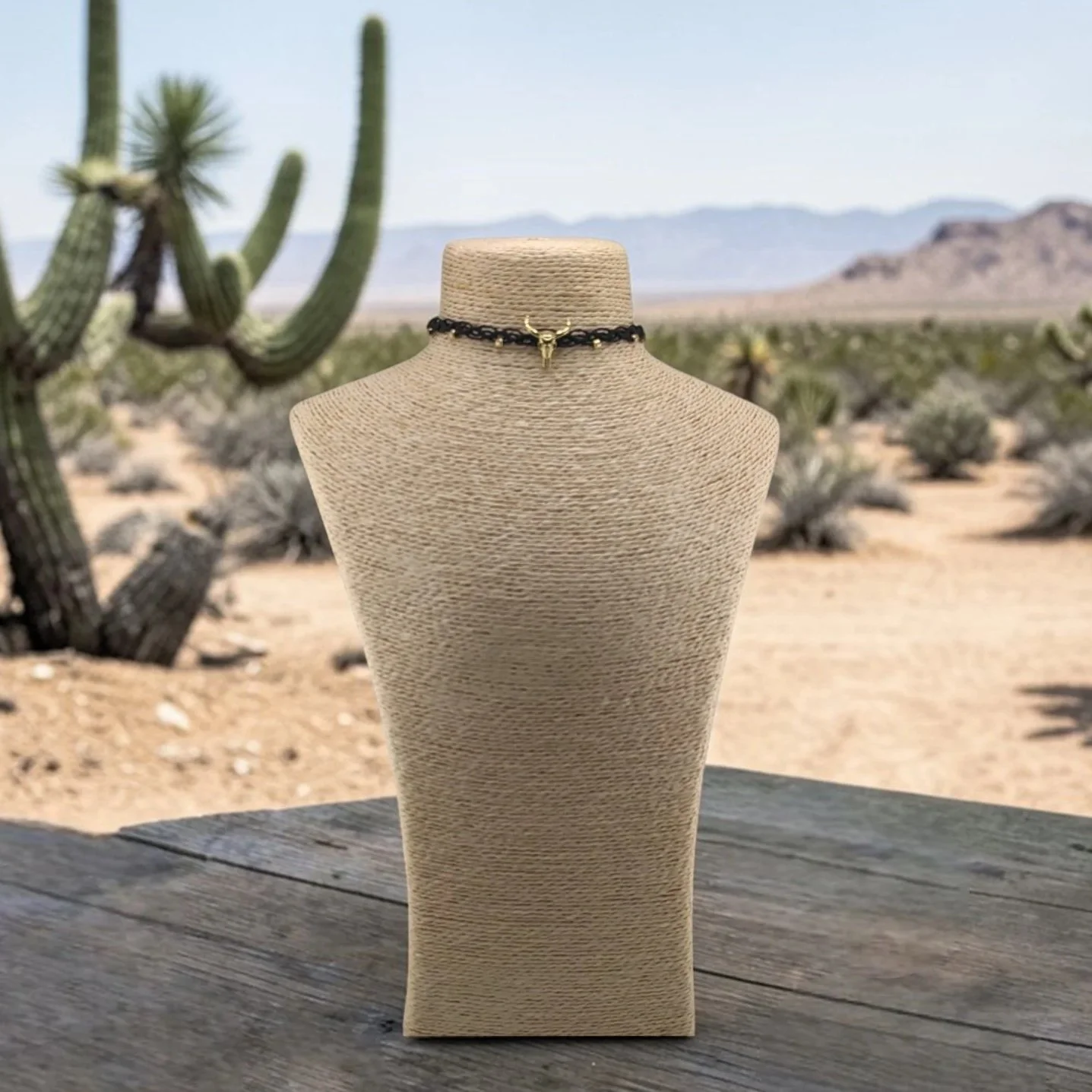 front view of  bull skull woven macrame choker on a bust in a western styles setting