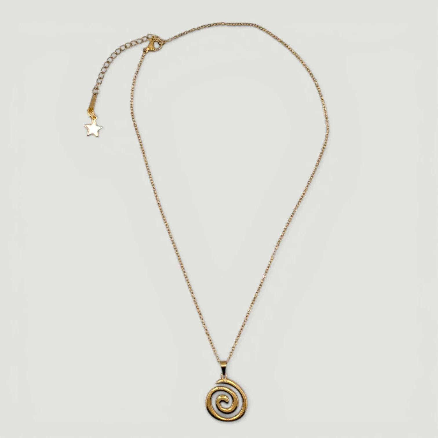 vortex spiral stainless steel necklace, gold full chain flat lay