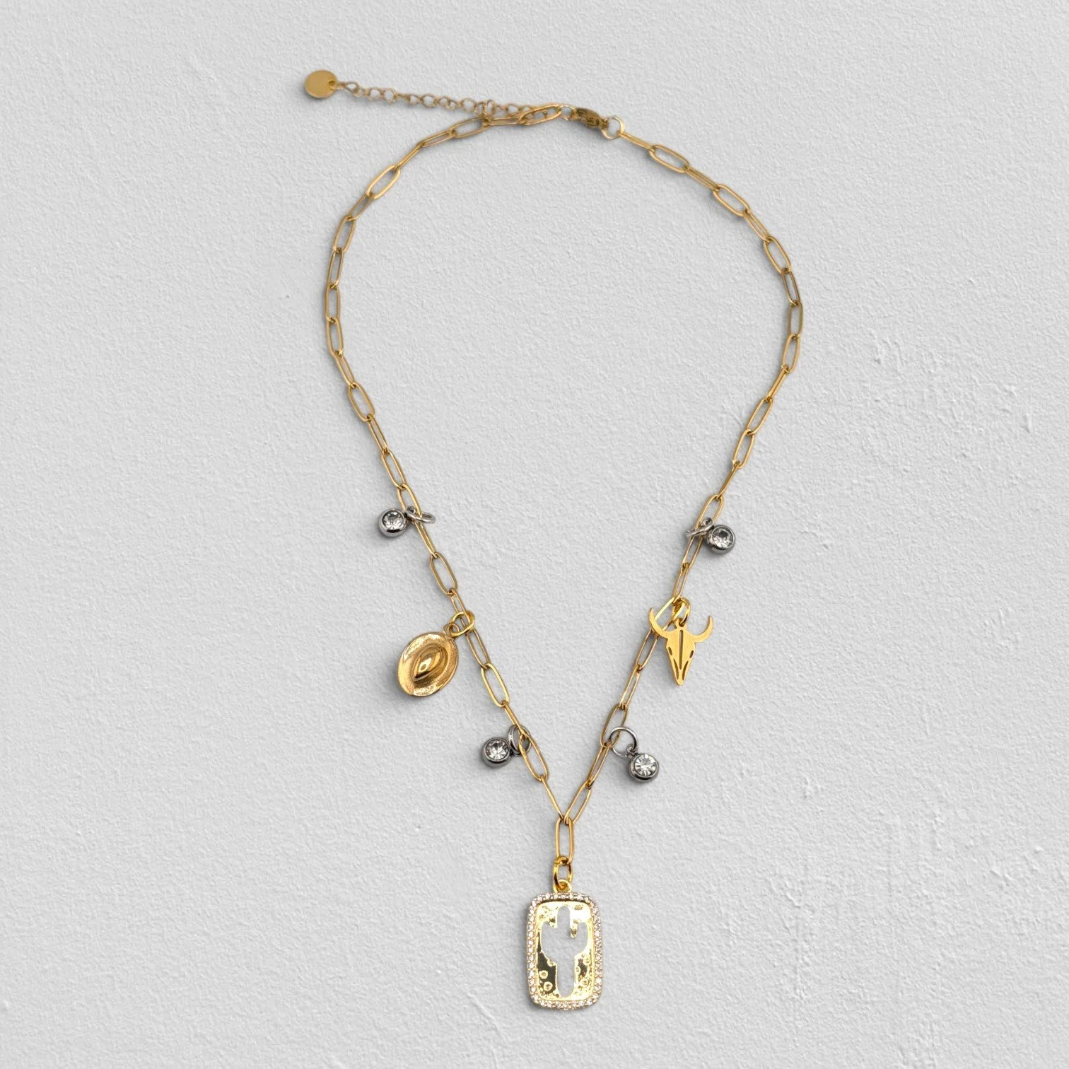 cactus and bull skull gold paperclip charm necklace full view flat lay