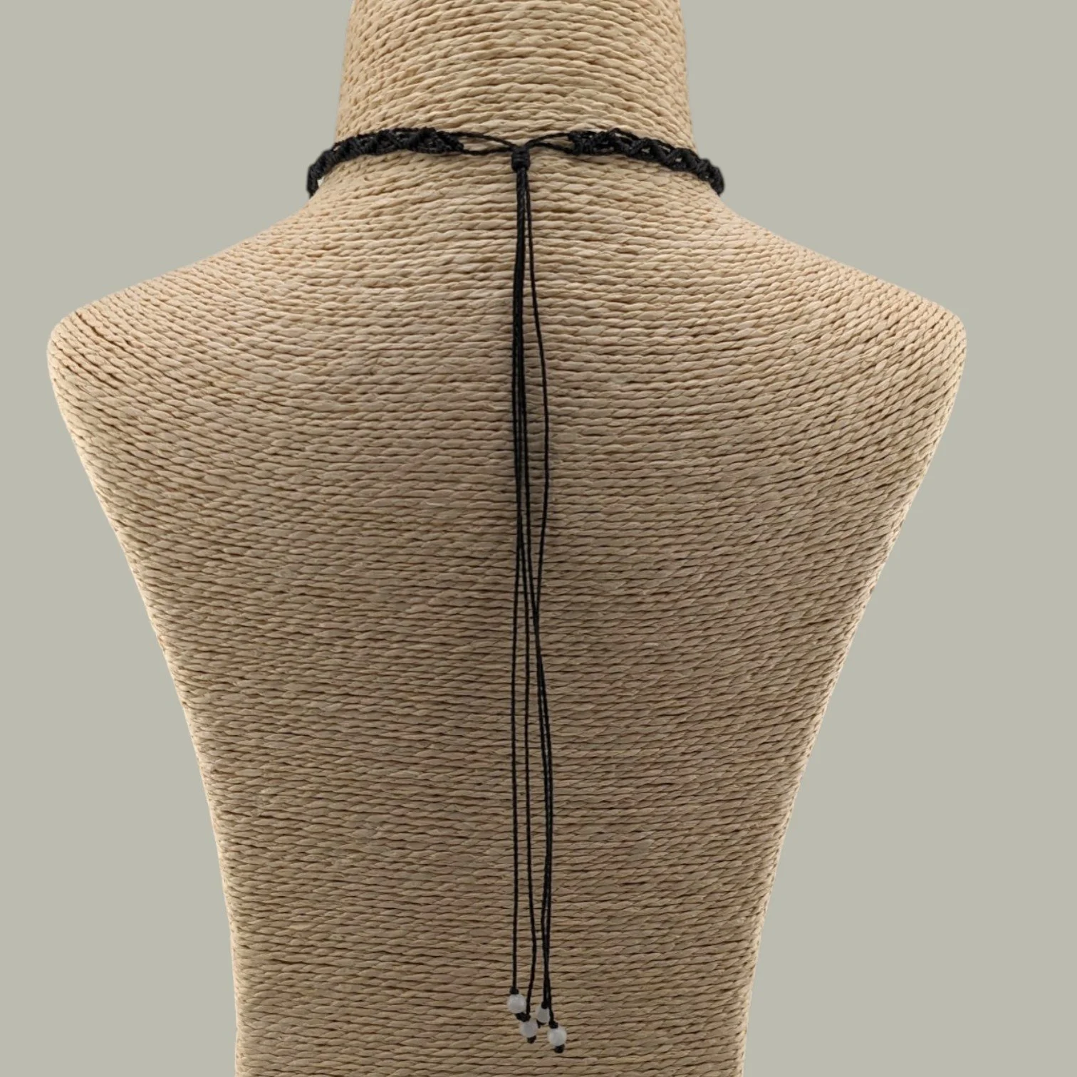 Full rear view of the freshwater pearl macrame choker.