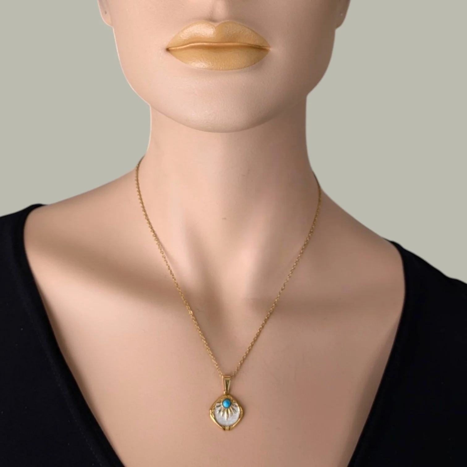 western sunburst white enamel stainless steel gold necklace worn on mannequin close up bust view