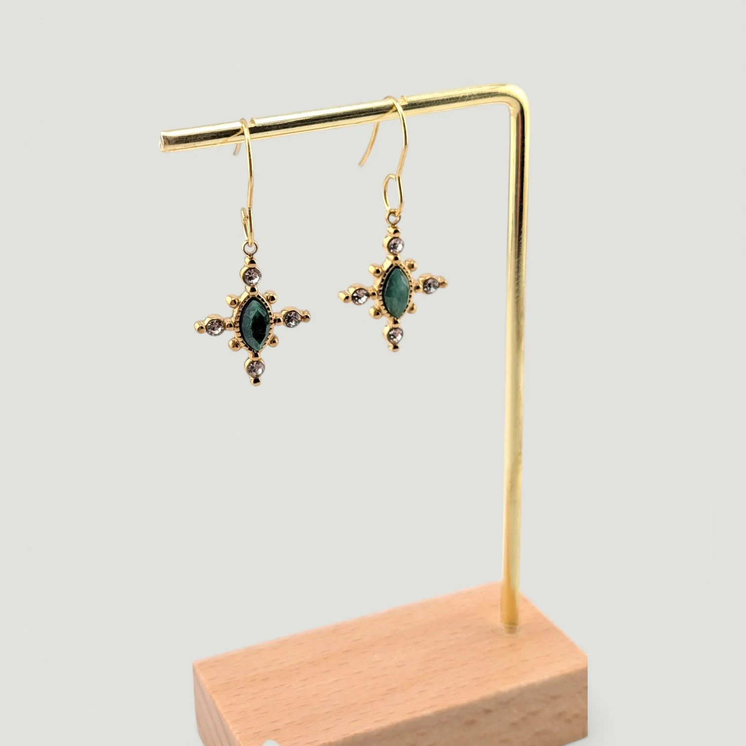 Horse eye African jade stainless steel drop earrings, gold, on earring stand, drop view