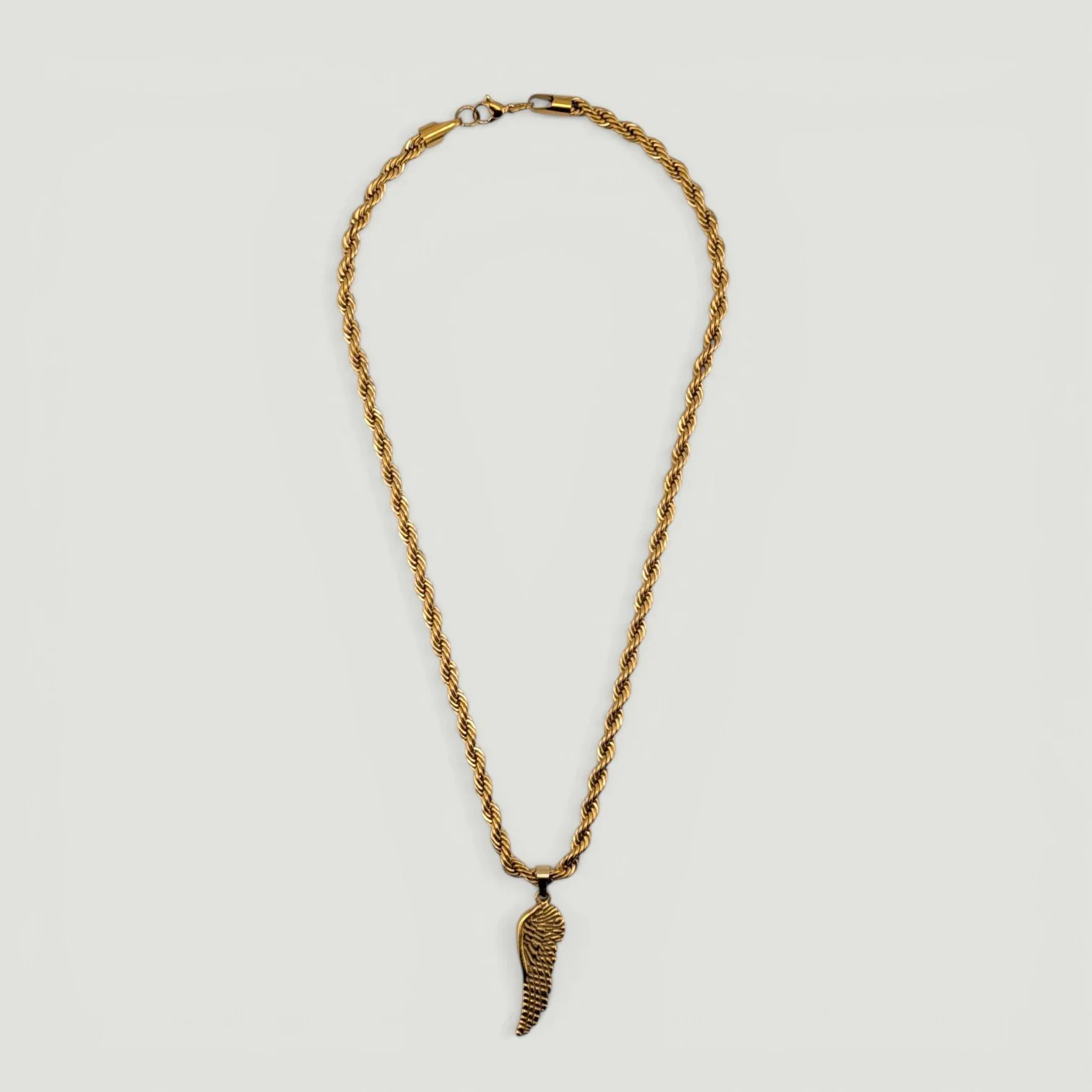 chunky wing gold stainless steel necklace full flat lay view