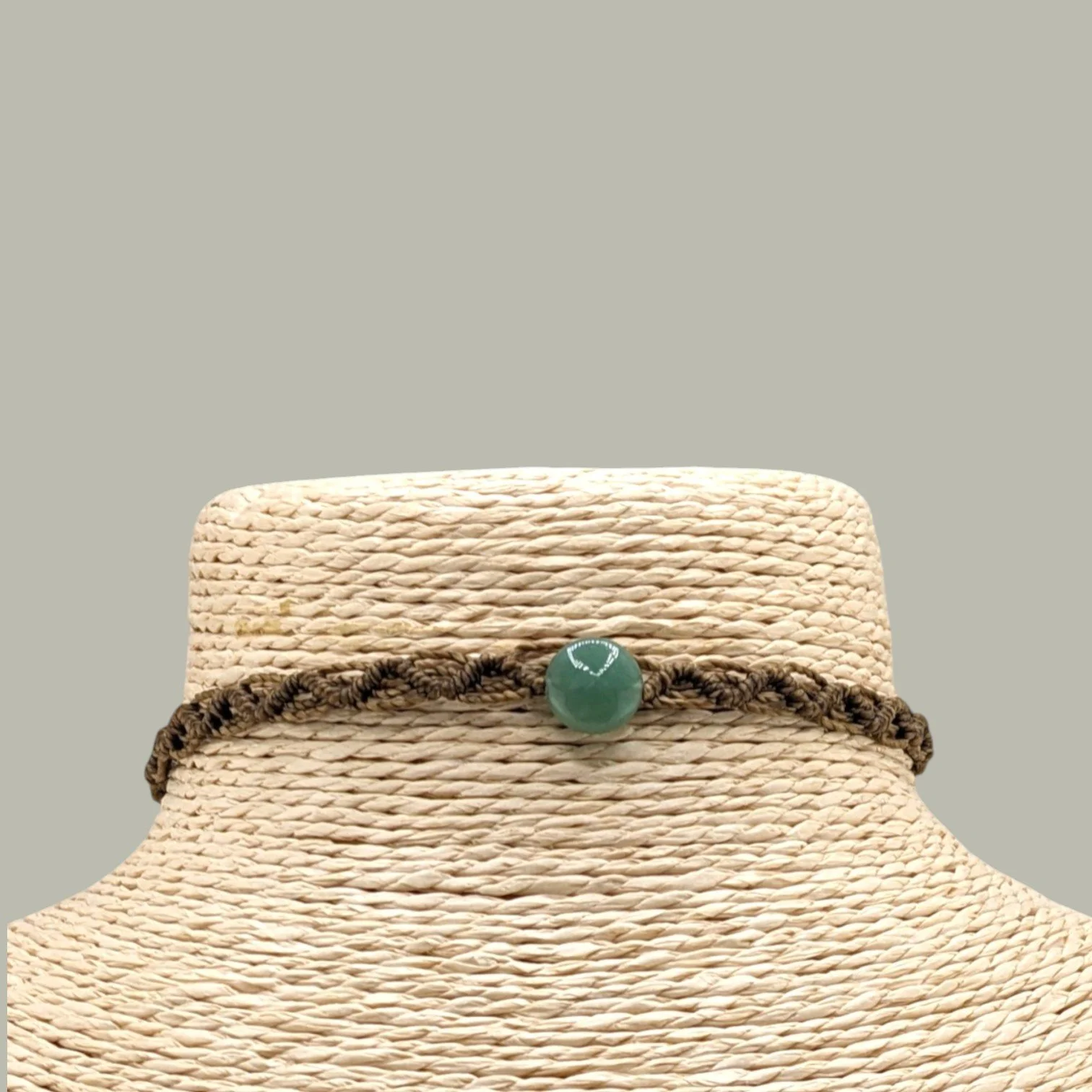 Close-uo of aventurine macrame western choker on jewelry bust