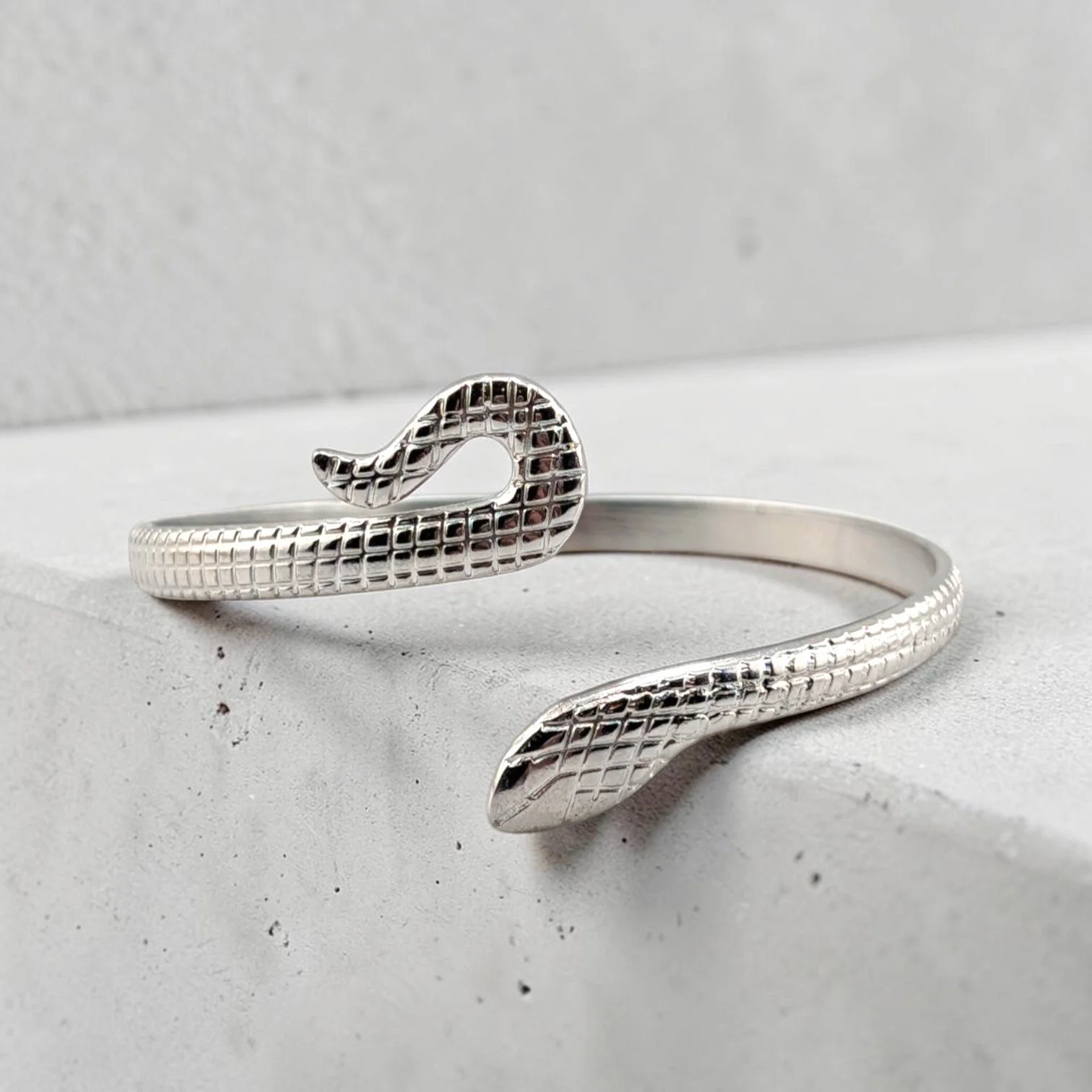 Silver snake stainless steel bangle bracelet, front view