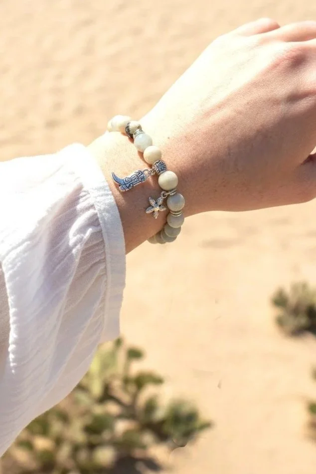 amazonite bracelet with a silver cowboy boot and flower charm