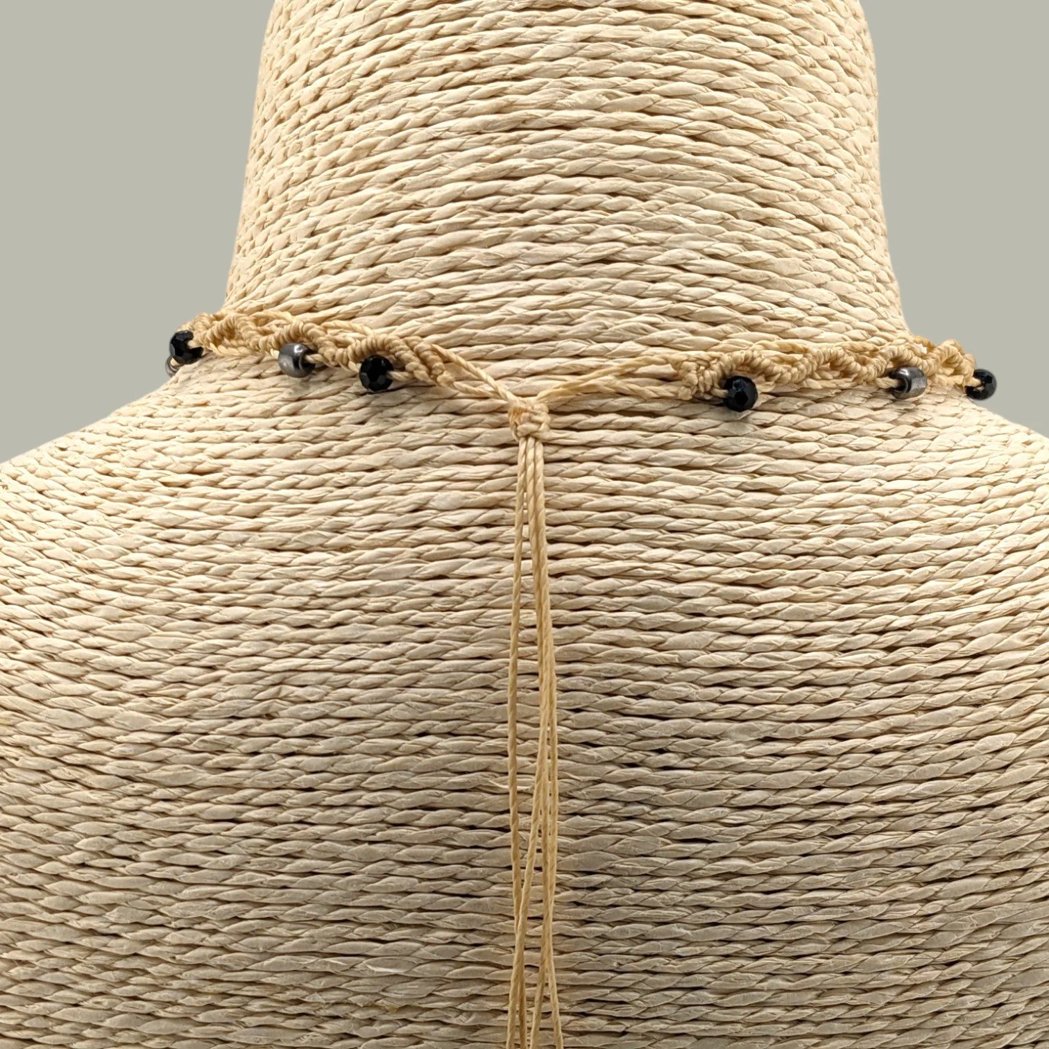 Back view close-up of macrame choker sliding knot closure showing adjustable cord design