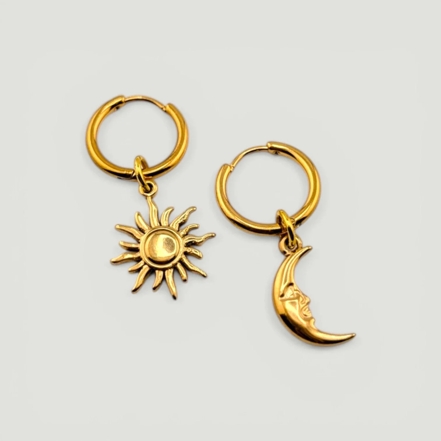 Sun & moon stainless steel huggie hoop earrings full set flat lay gold