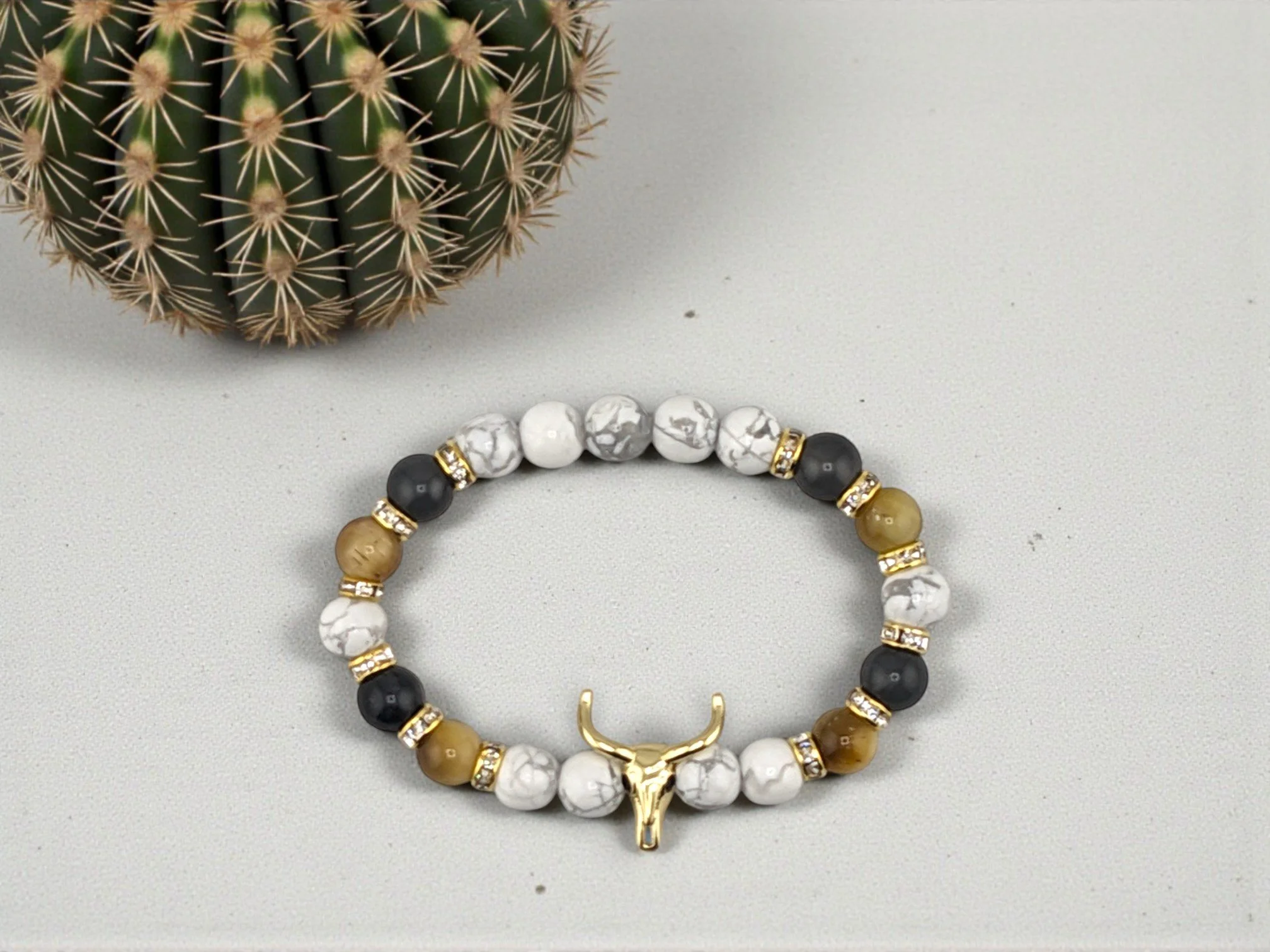bull skull beaded bracelet with howlite, gold tiger eye and cloudy quartz separated with rhinestones spacers