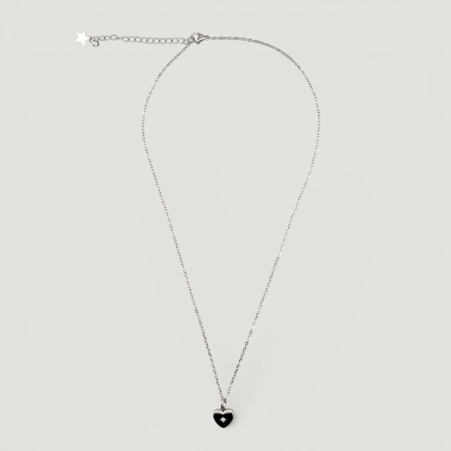 silver stainless steel starburst heart necklace full chain, flat lay