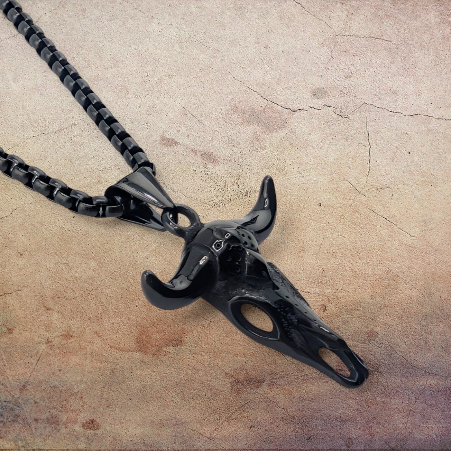 men's bull skull black stainless steel necklace side view close up showing sculpted pendant details