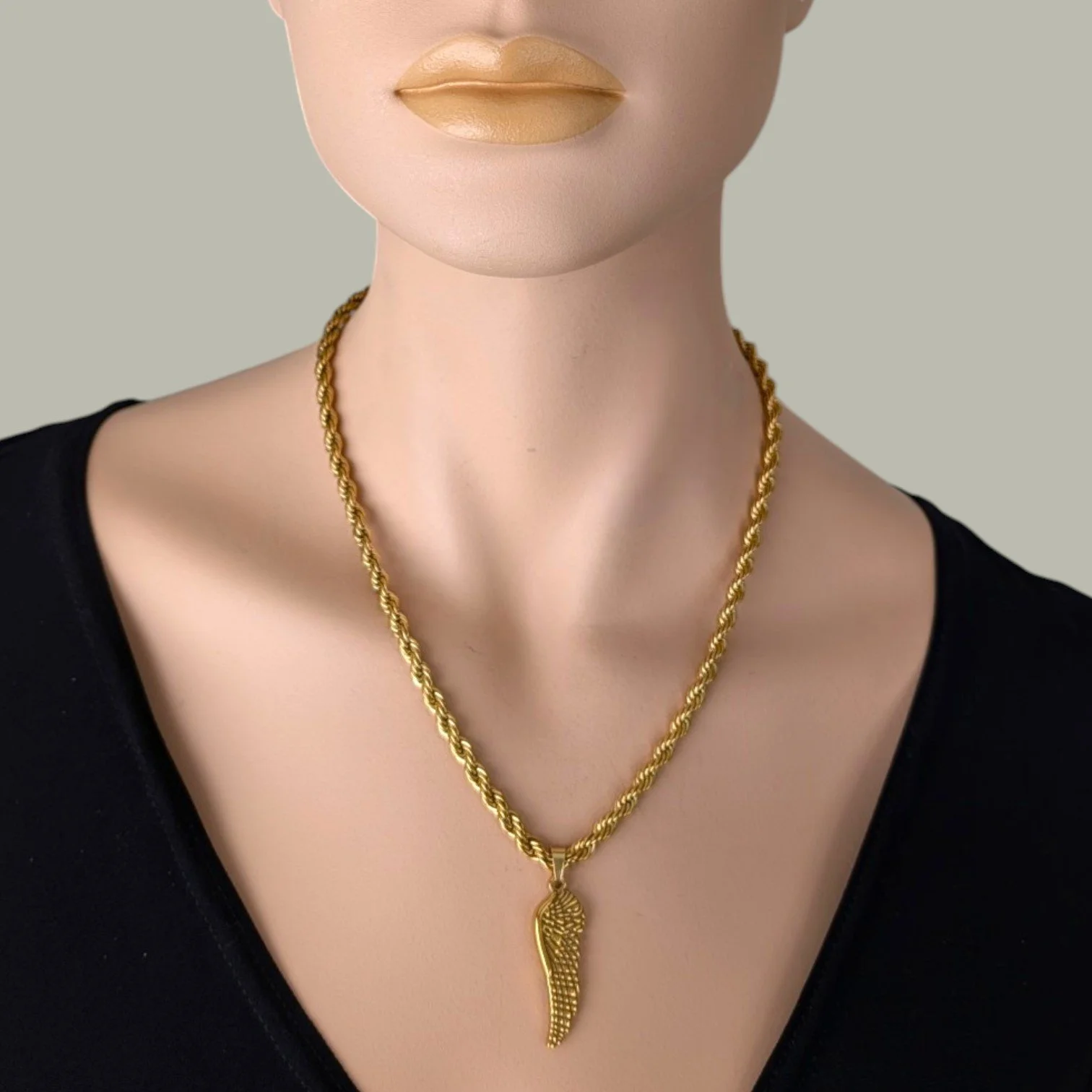 chunky wing gold stainless steel necklace on mannequin bust close up