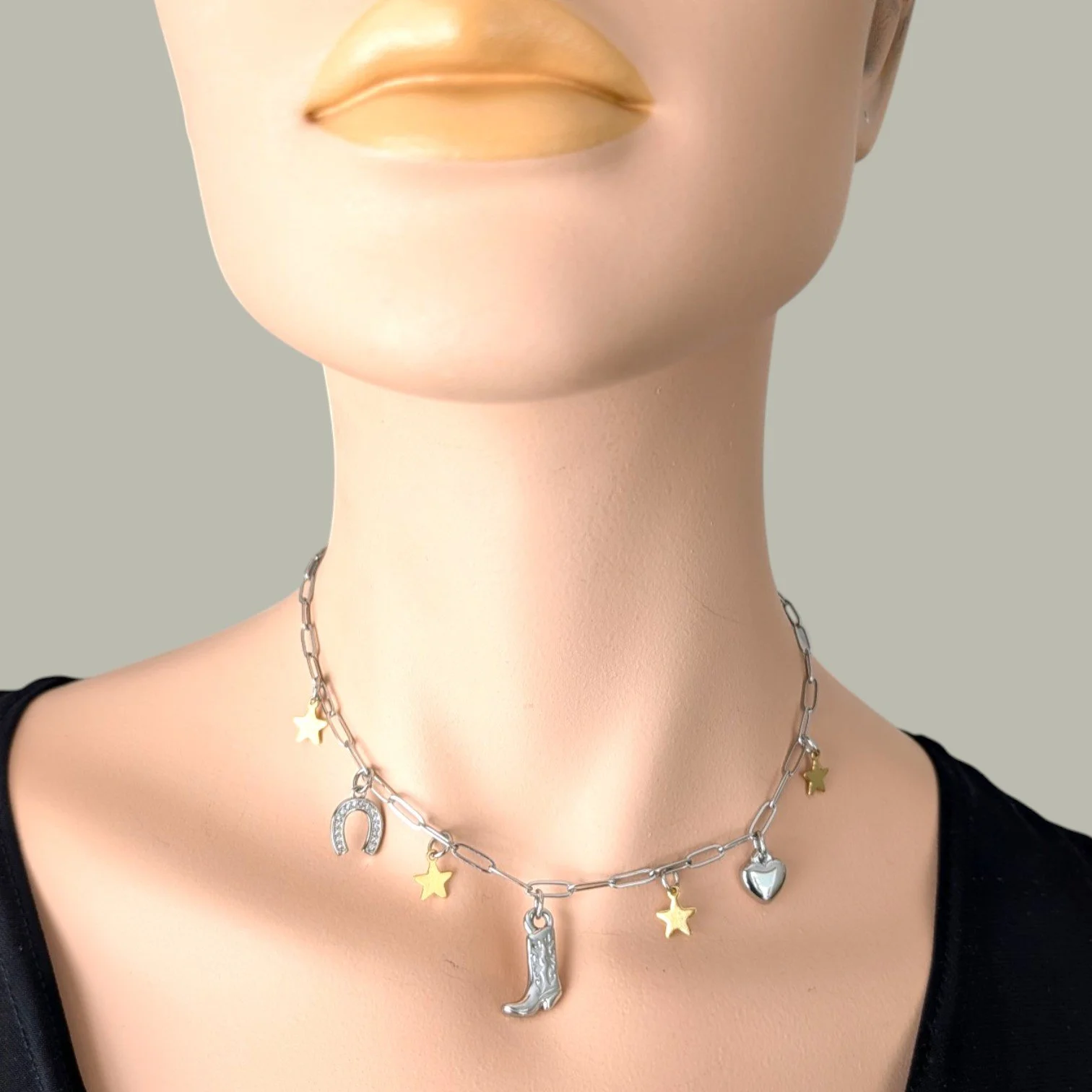 silver cowboy boot stainless steel charm necklace on mannequin bust close up