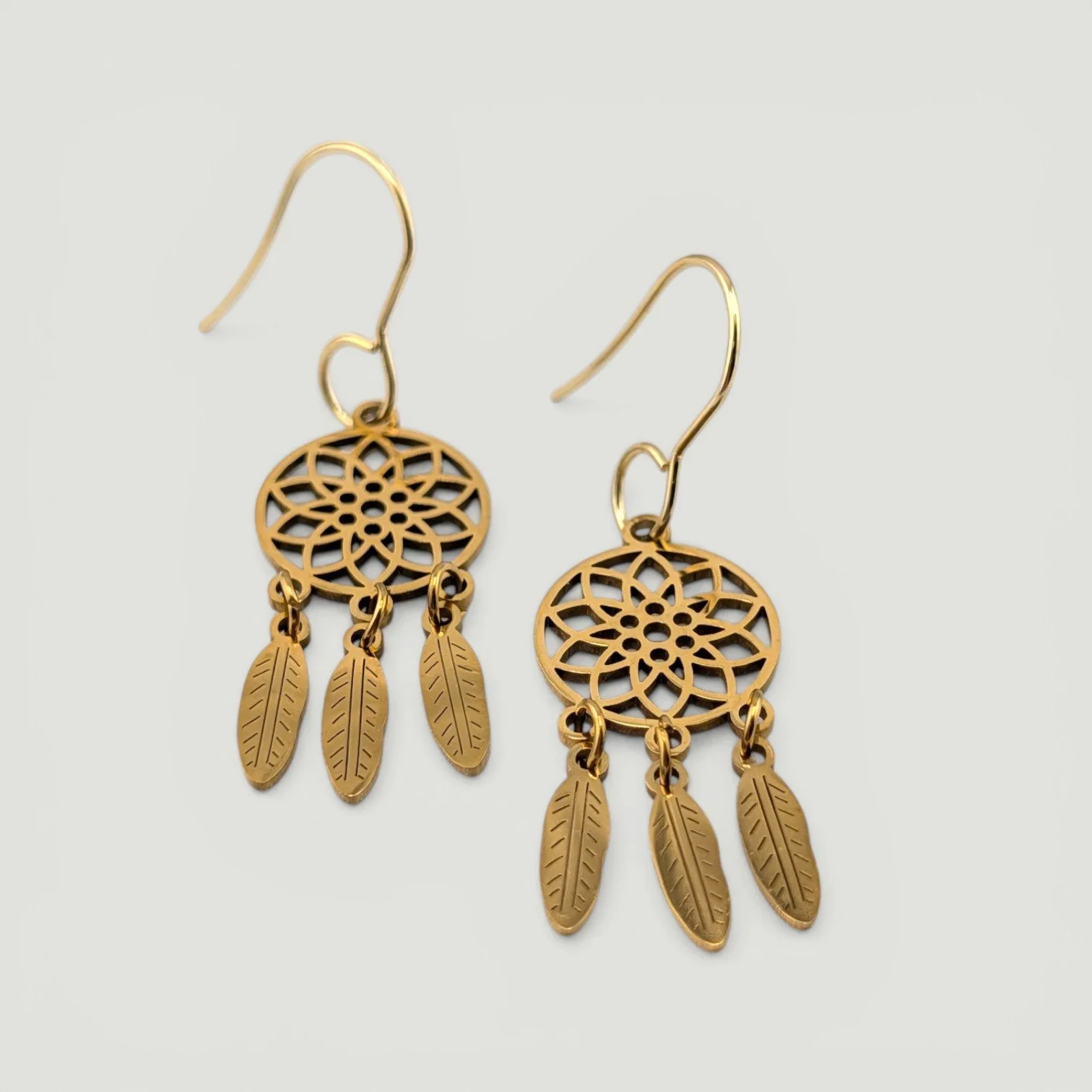 Dreamcatcher stainless steel drop earrings, gold, flat lay