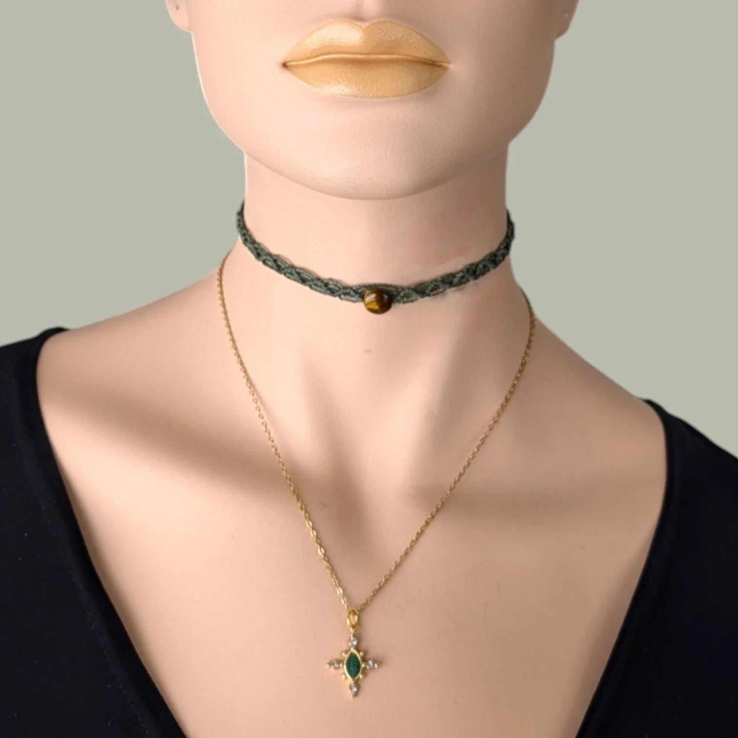 Horse eye African jade necklace on a gold stainless steel chain layered with tiger eye macrame choker on mannequin, close up bust view
